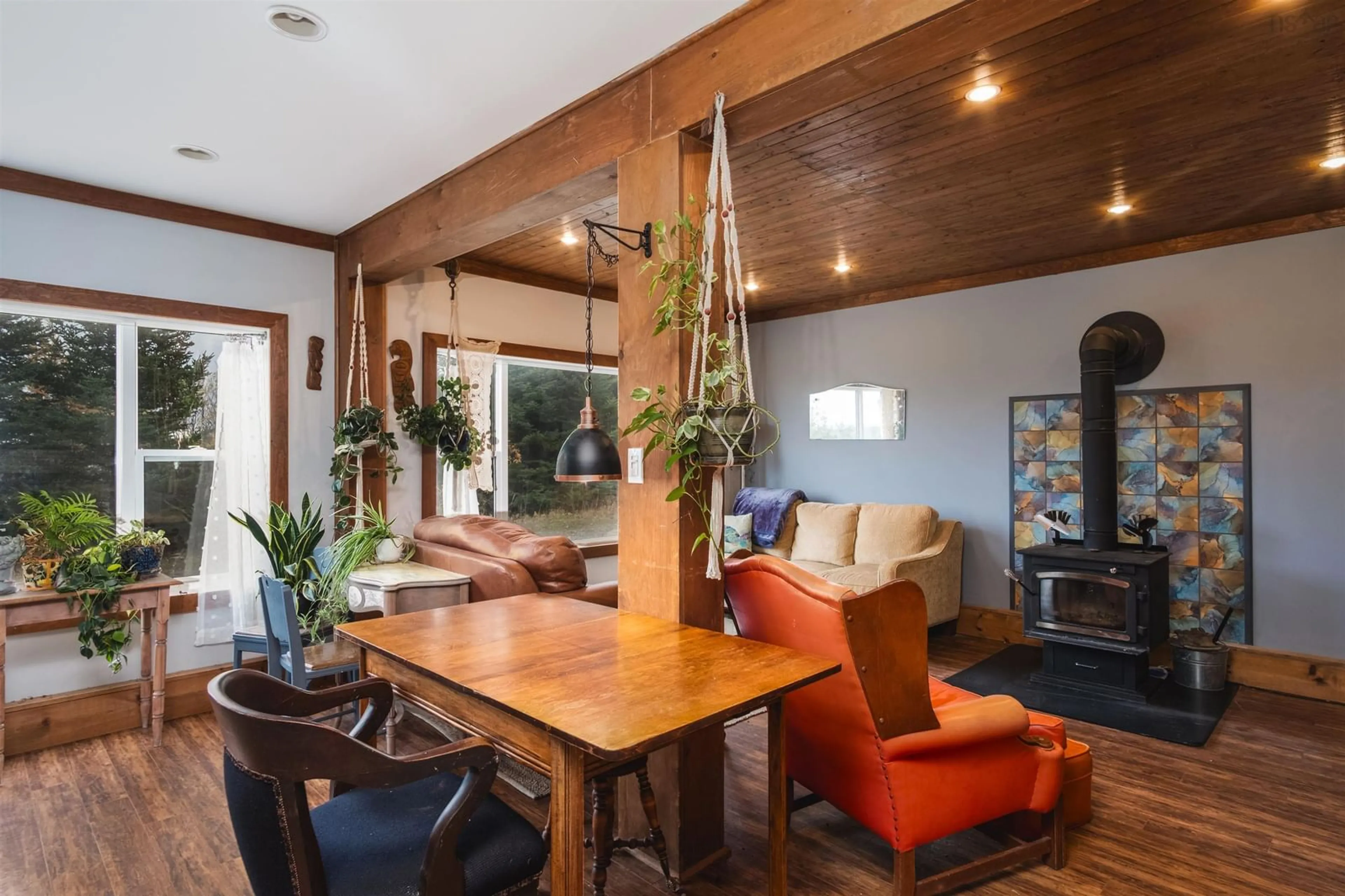 Living room with furniture, wood/laminate floor for 10198 Grenville St, St. Peter's Nova Scotia B0E 3B0