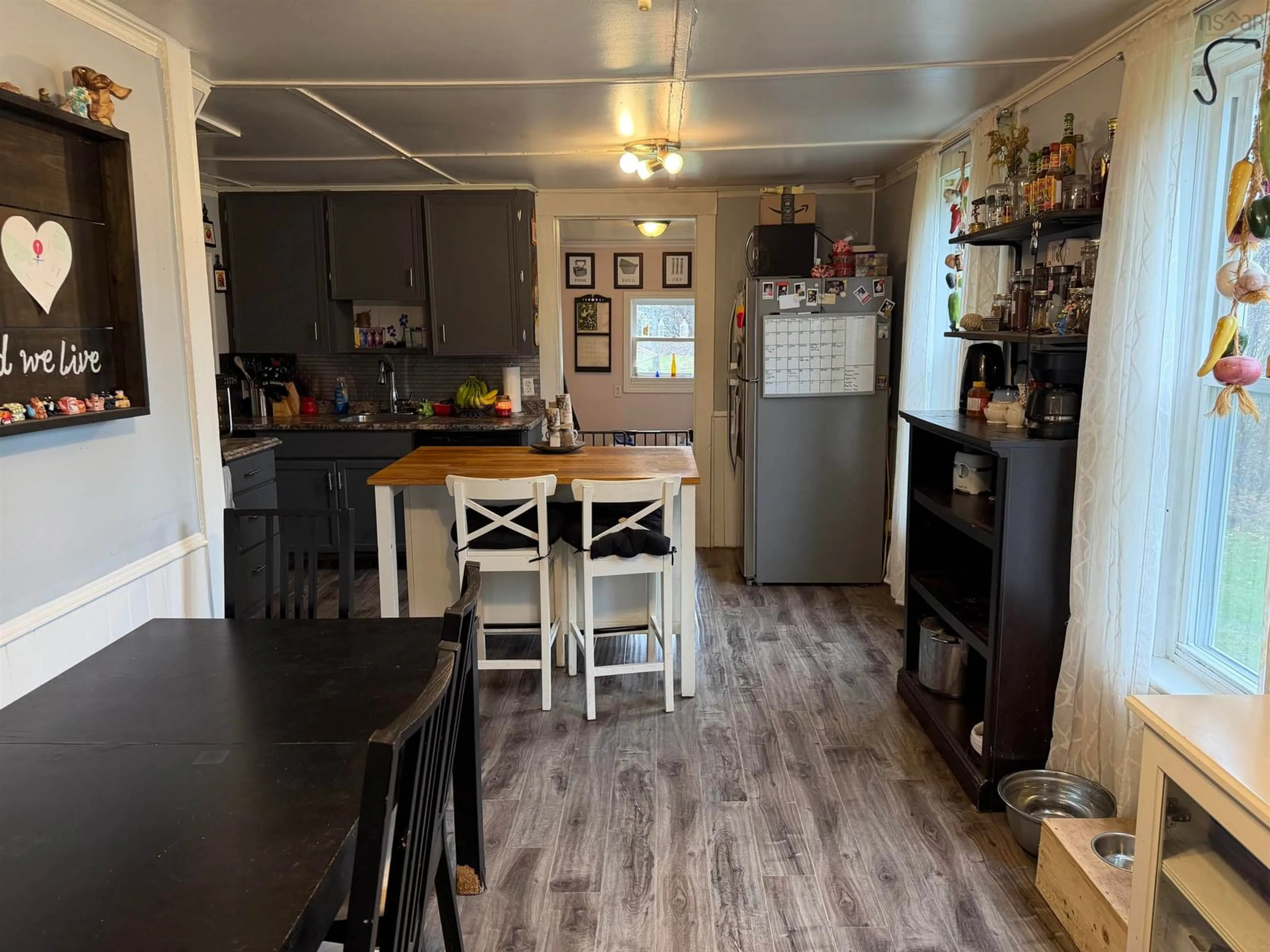 Open concept kitchen, wood/laminate floor for 2149 Cowan St, Westville Nova Scotia B0K 2A0