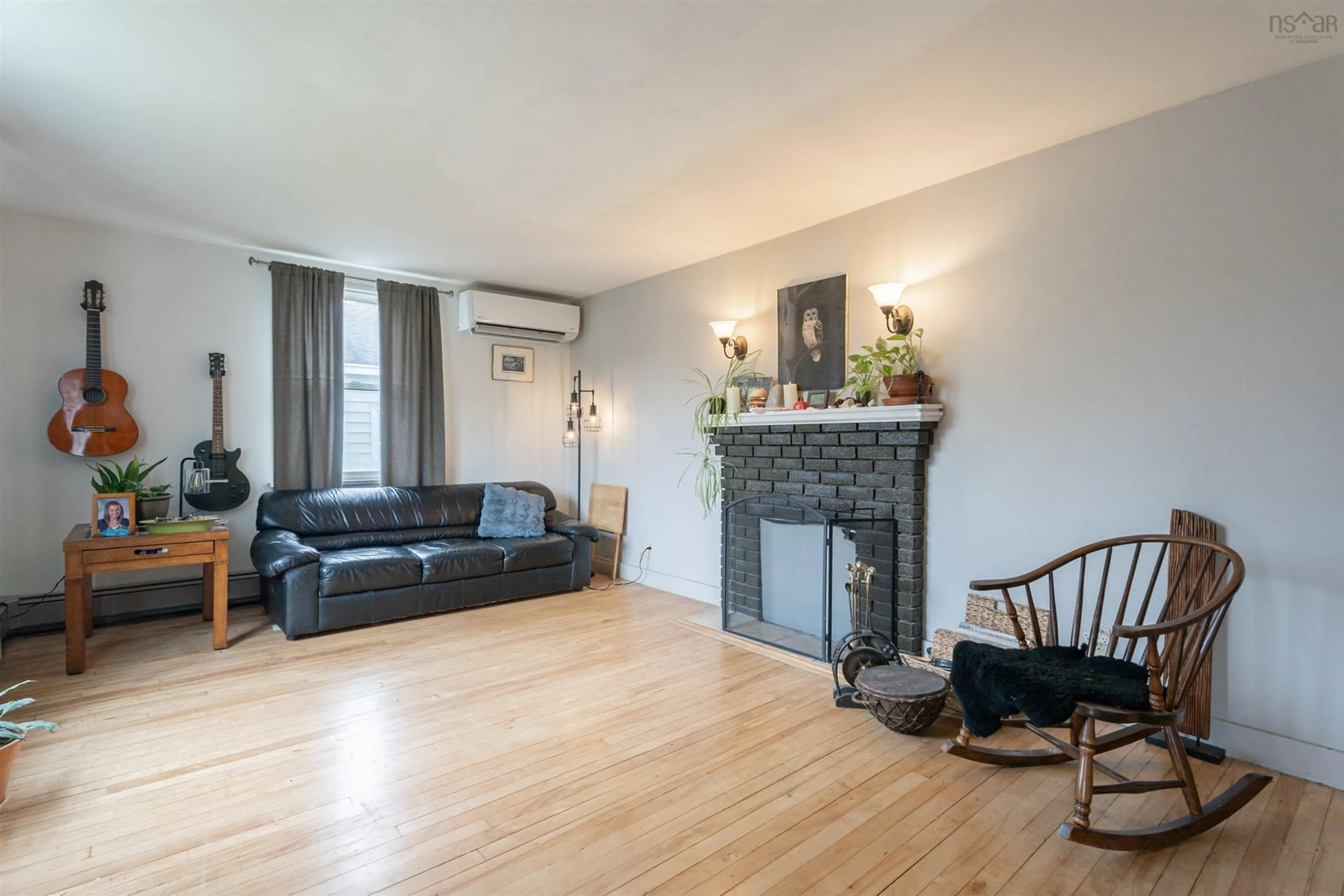 Living room with furniture, wood/laminate floor for 7 Faulkner St, Harbourview Nova Scotia B3A 3A1