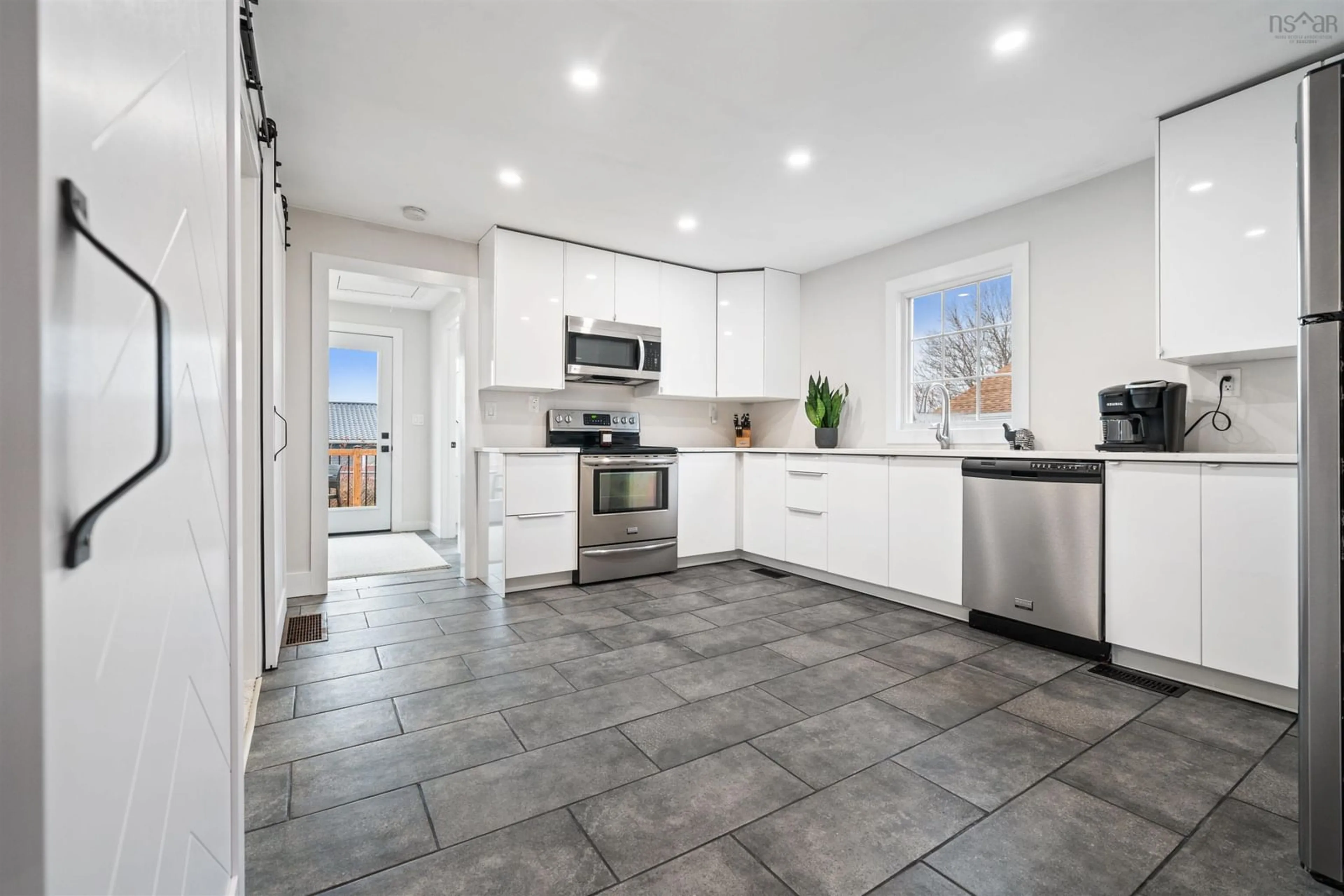 Open concept kitchen, ceramic/tile floor for 23 Levis St, Halifax Nova Scotia B3R 1M1