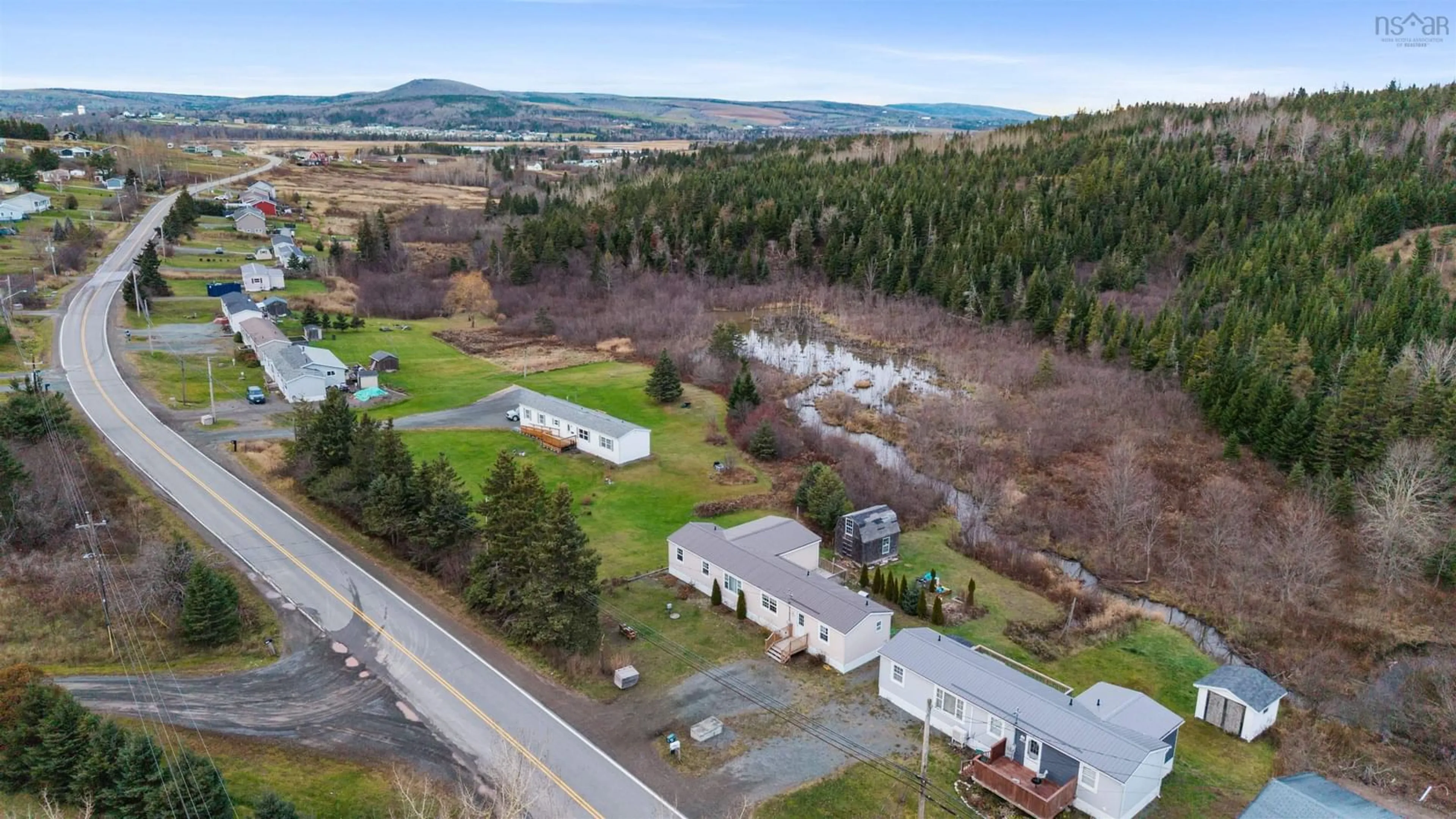 A pic from outside/outdoor area/front of a property/back of a property/a pic from drone, mountain view for 4307 South River Rd, Williams Point Nova Scotia B2G 0B4