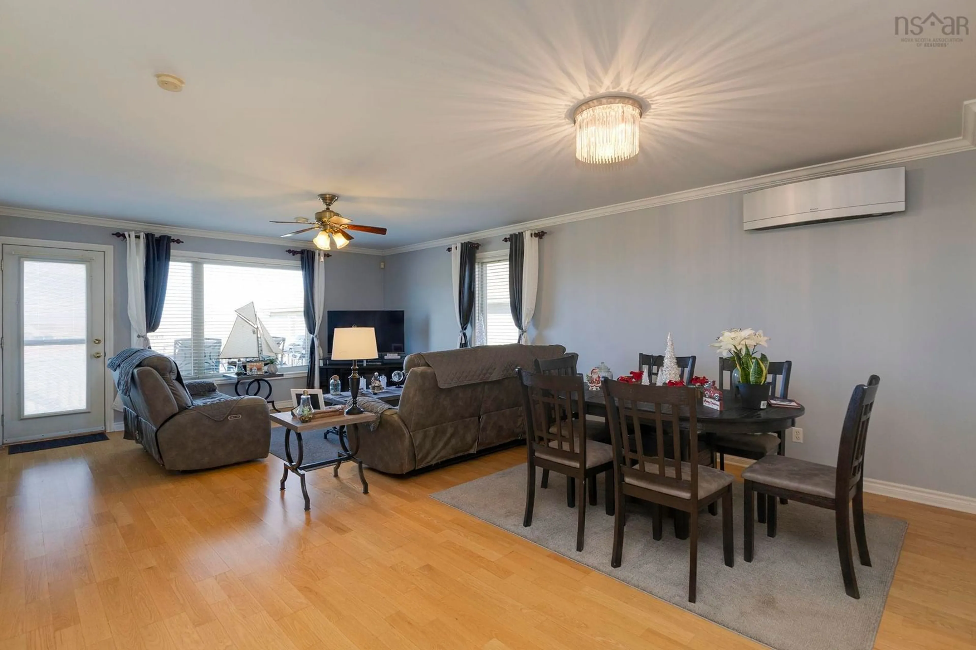 Living room with furniture, wood/laminate floor for 113 Simpson Rd #23, Braeshore Nova Scotia B0K 1H0