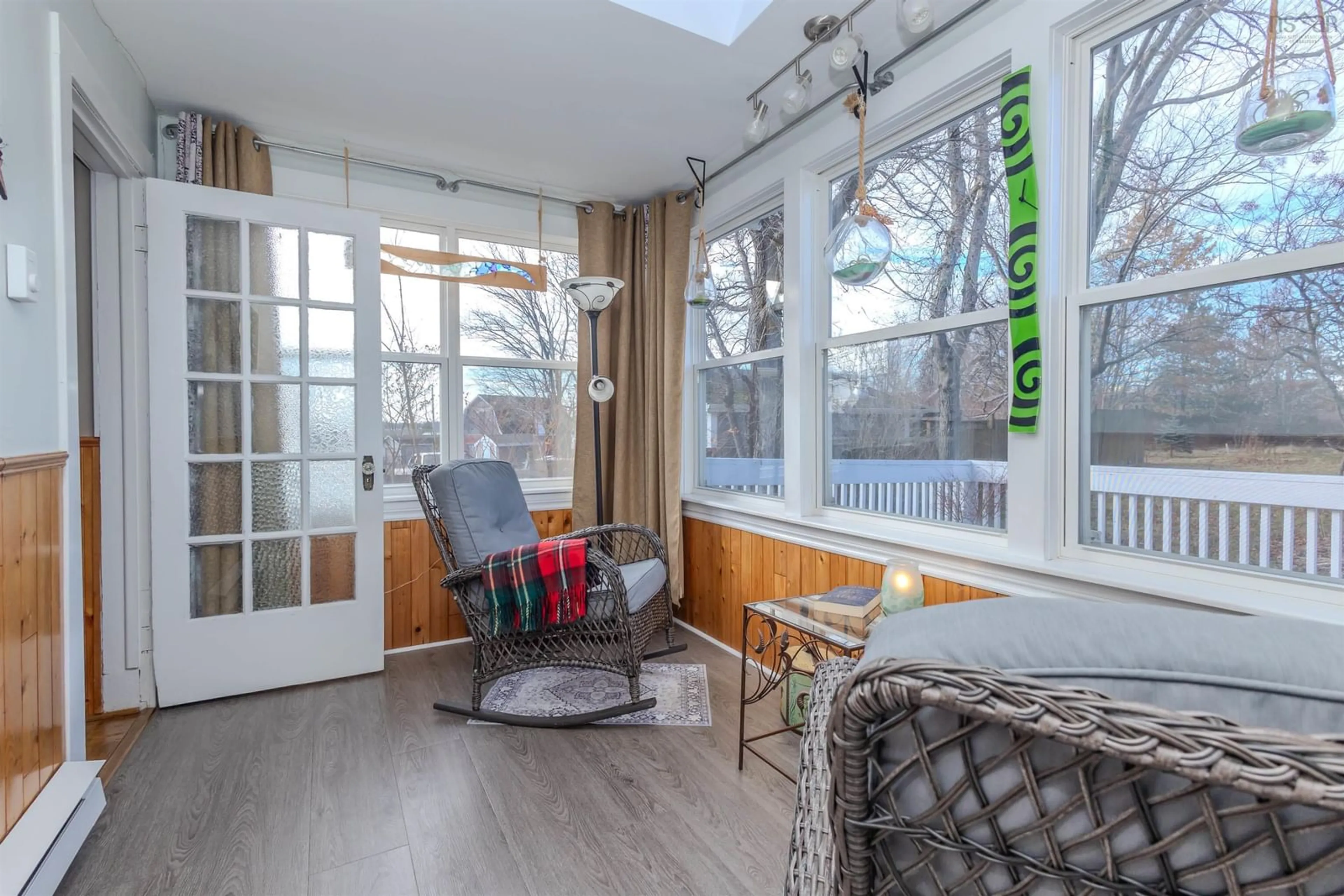 Living room with furniture, wood/laminate floor for 340 King Edward St, Glace Bay Nova Scotia B1A 3W3
