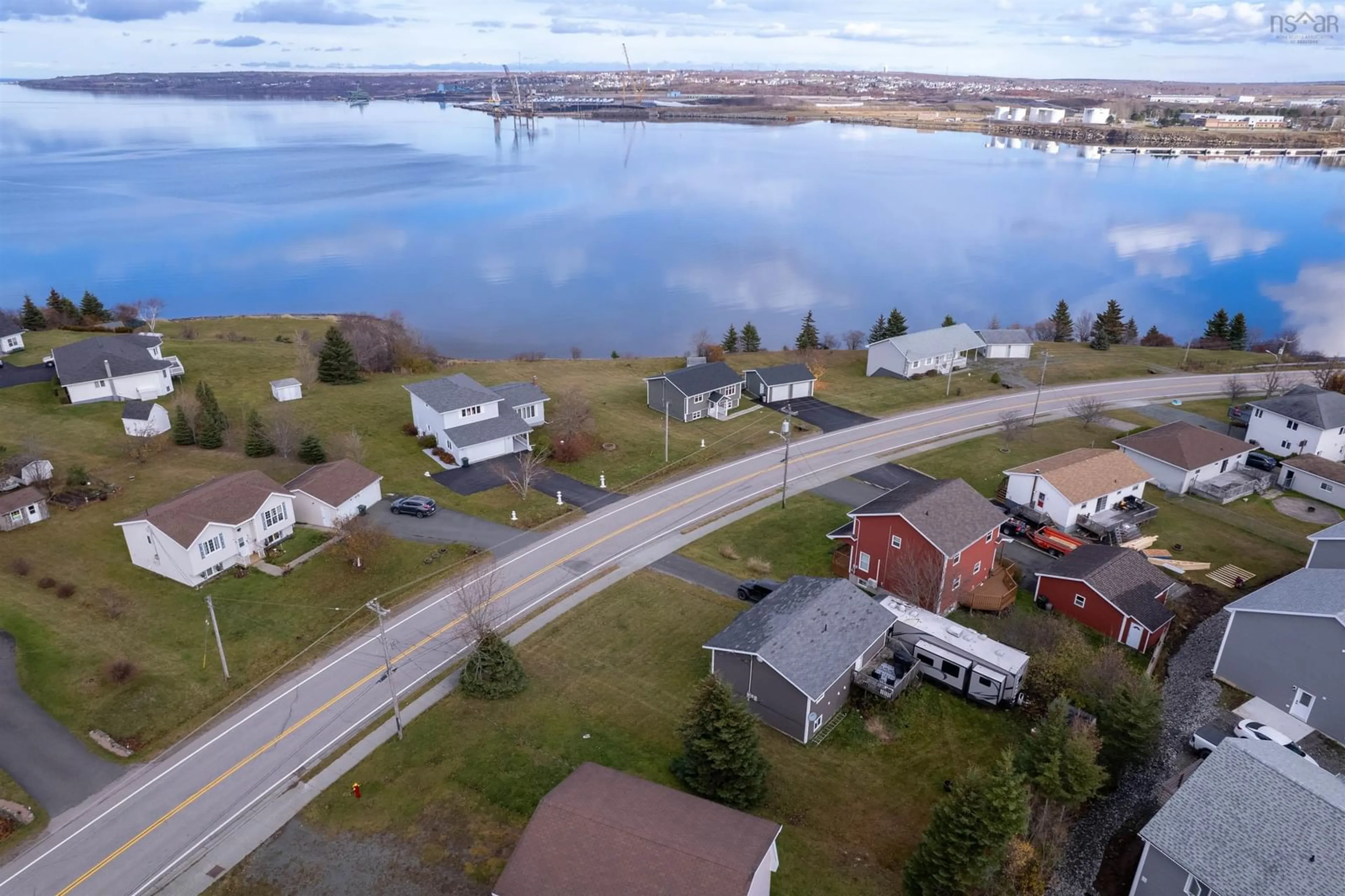 A pic from outside/outdoor area/front of a property/back of a property/a pic from drone, water/lake/river/ocean view for 967 Westmount Rd, Sydney Nova Scotia B1R 1C5
