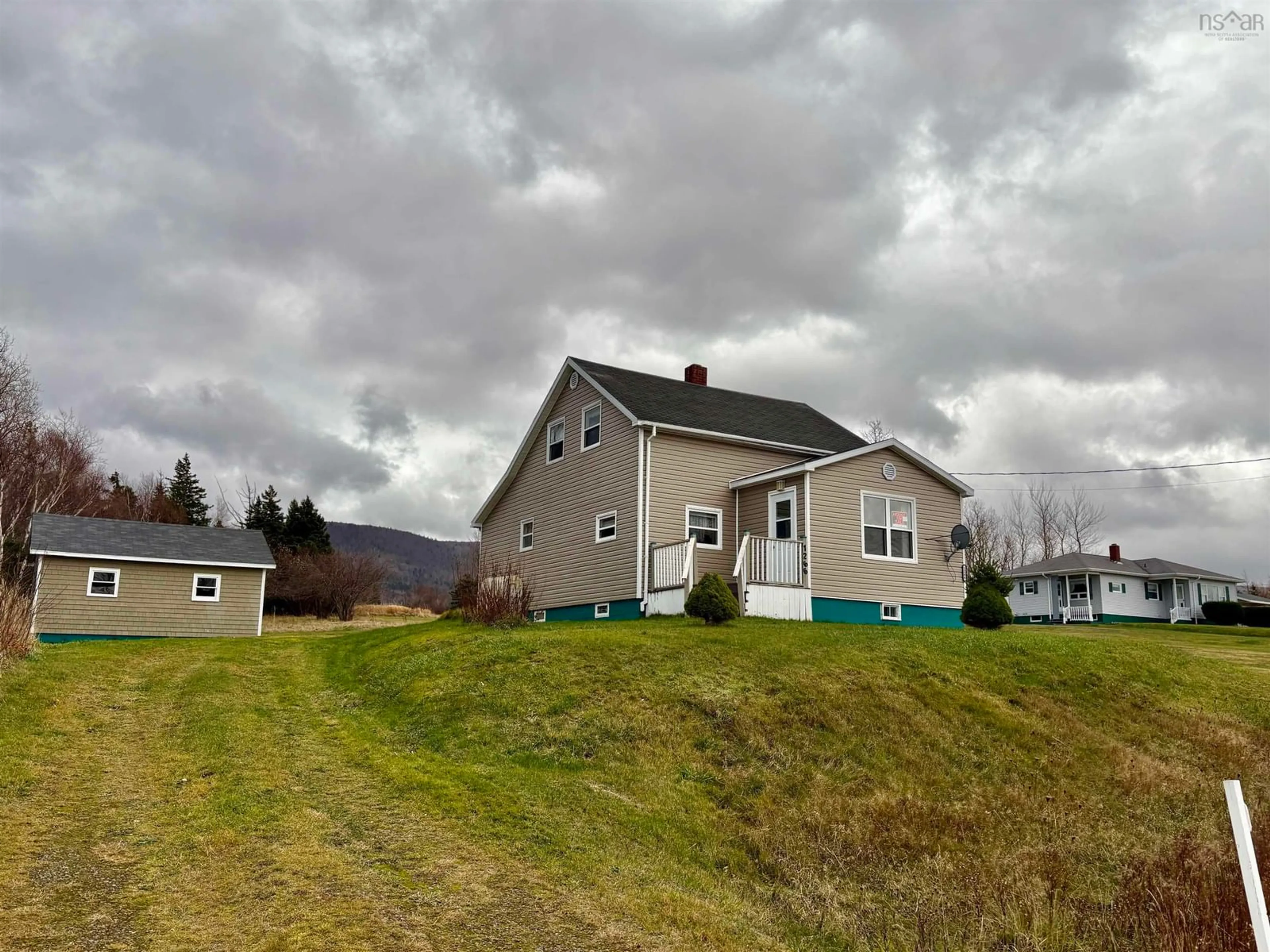 A pic from outside/outdoor area/front of a property/back of a property/a pic from drone, mountain view for 1266 Back Road, Chéticamp Nova Scotia B0E 1H0