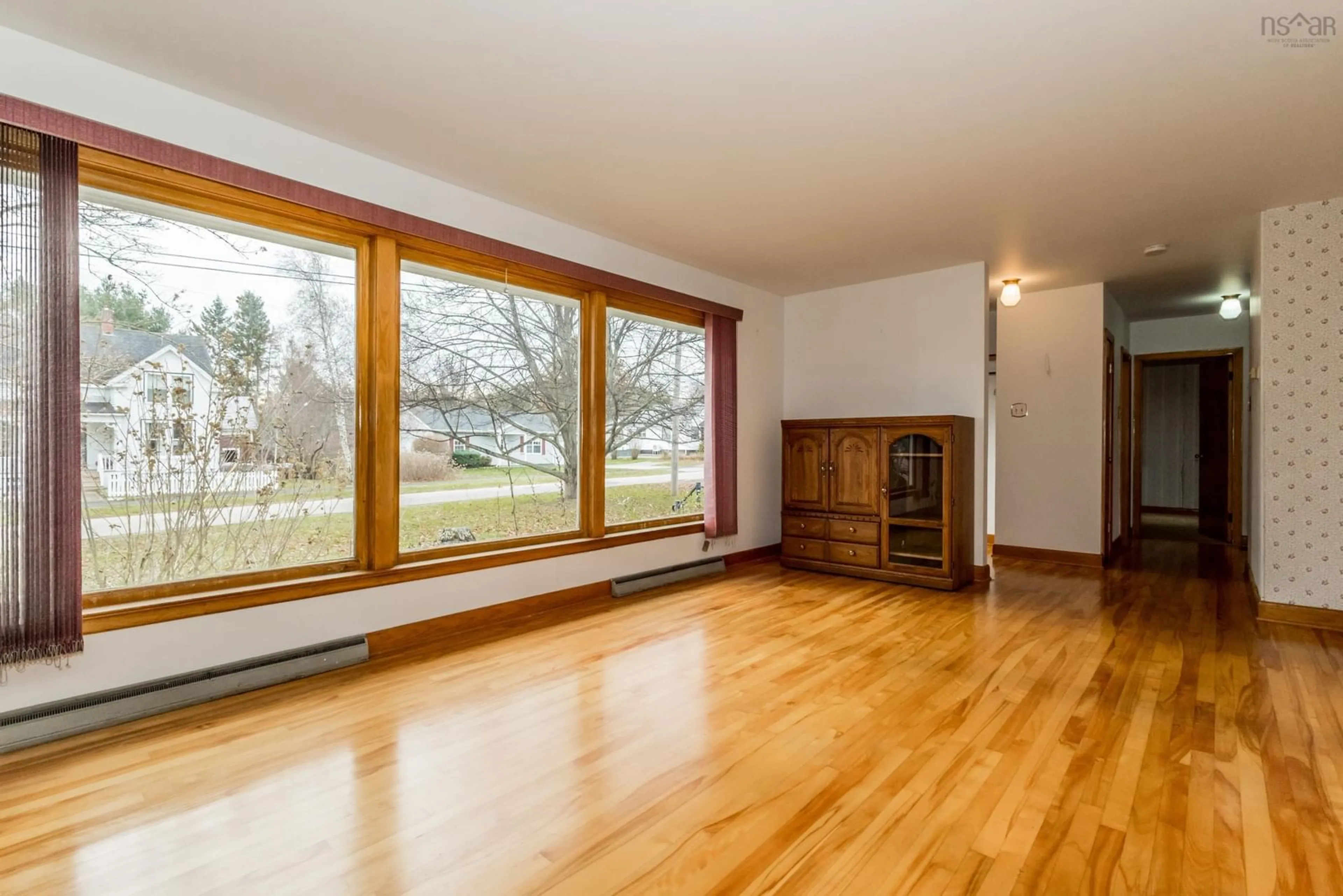 Living room with furniture, wood/laminate floor for 101 Union St, Berwick Nova Scotia B0P 1E0