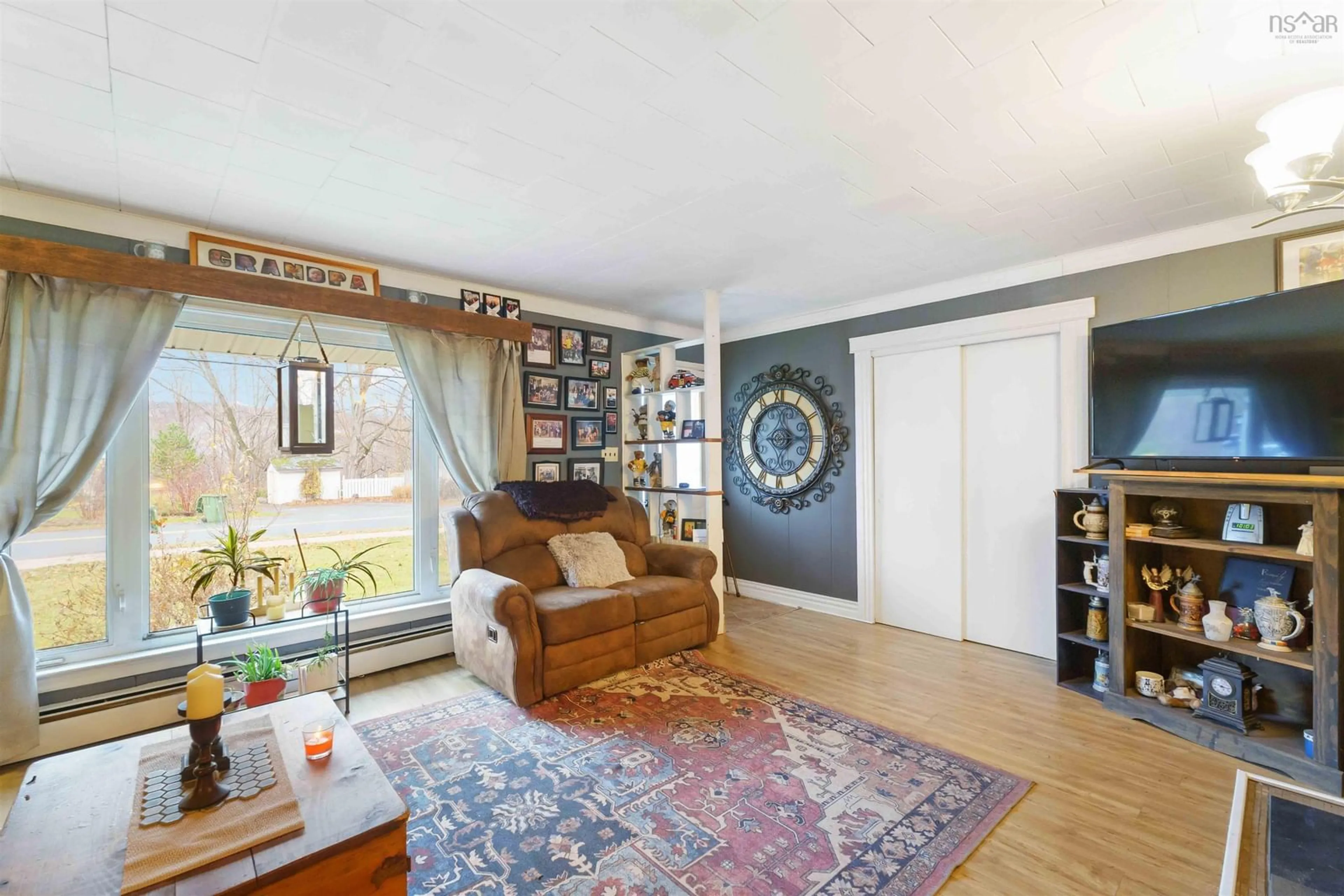 Living room with furniture, wood/laminate floor for 182 Canaan Ave, Kentville Nova Scotia B4N 2B1