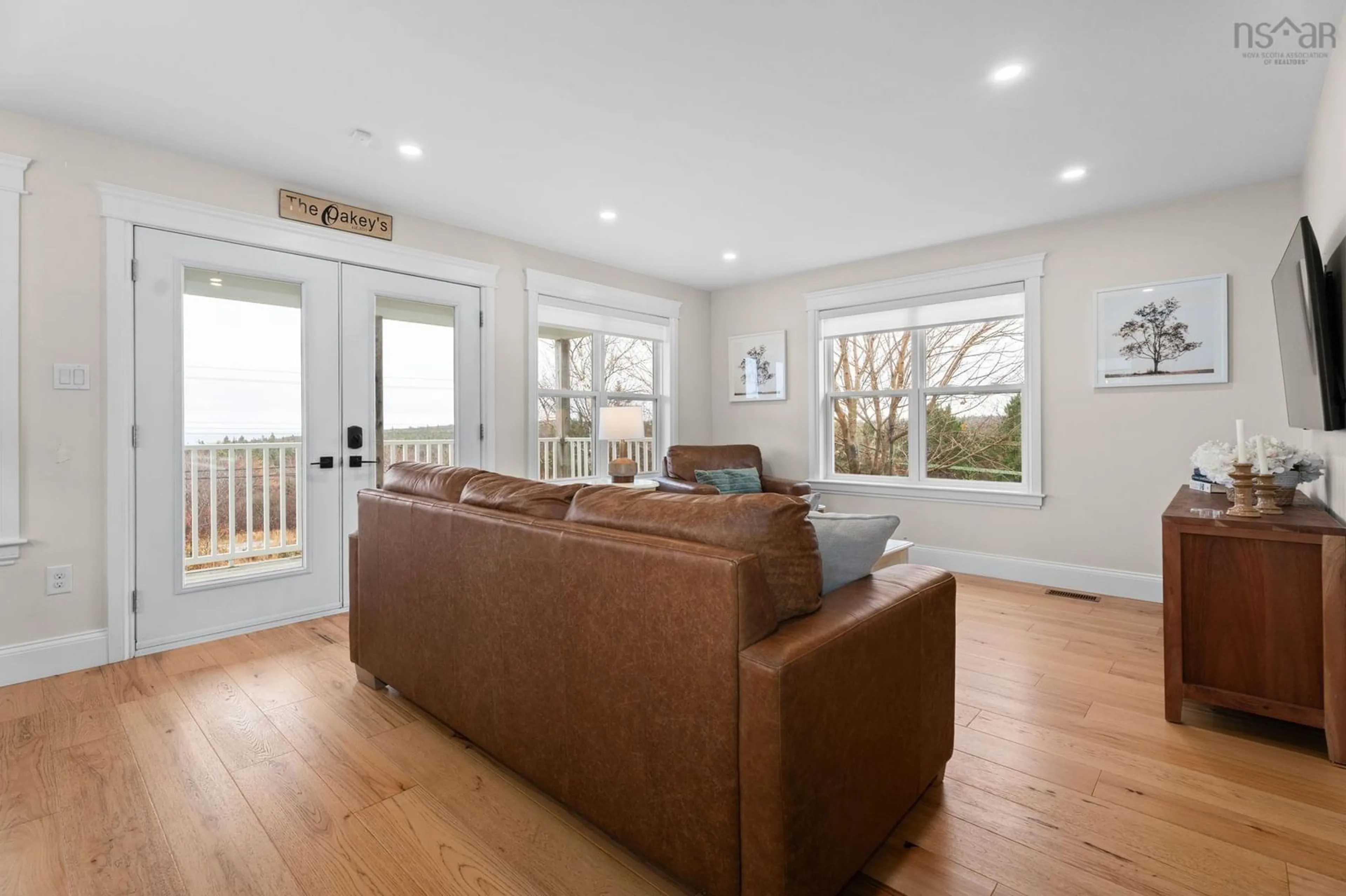 Living room with furniture, wood/laminate floor for 761 Ketch Harbour Rd, Portuguese Cove Nova Scotia B3V 1K2