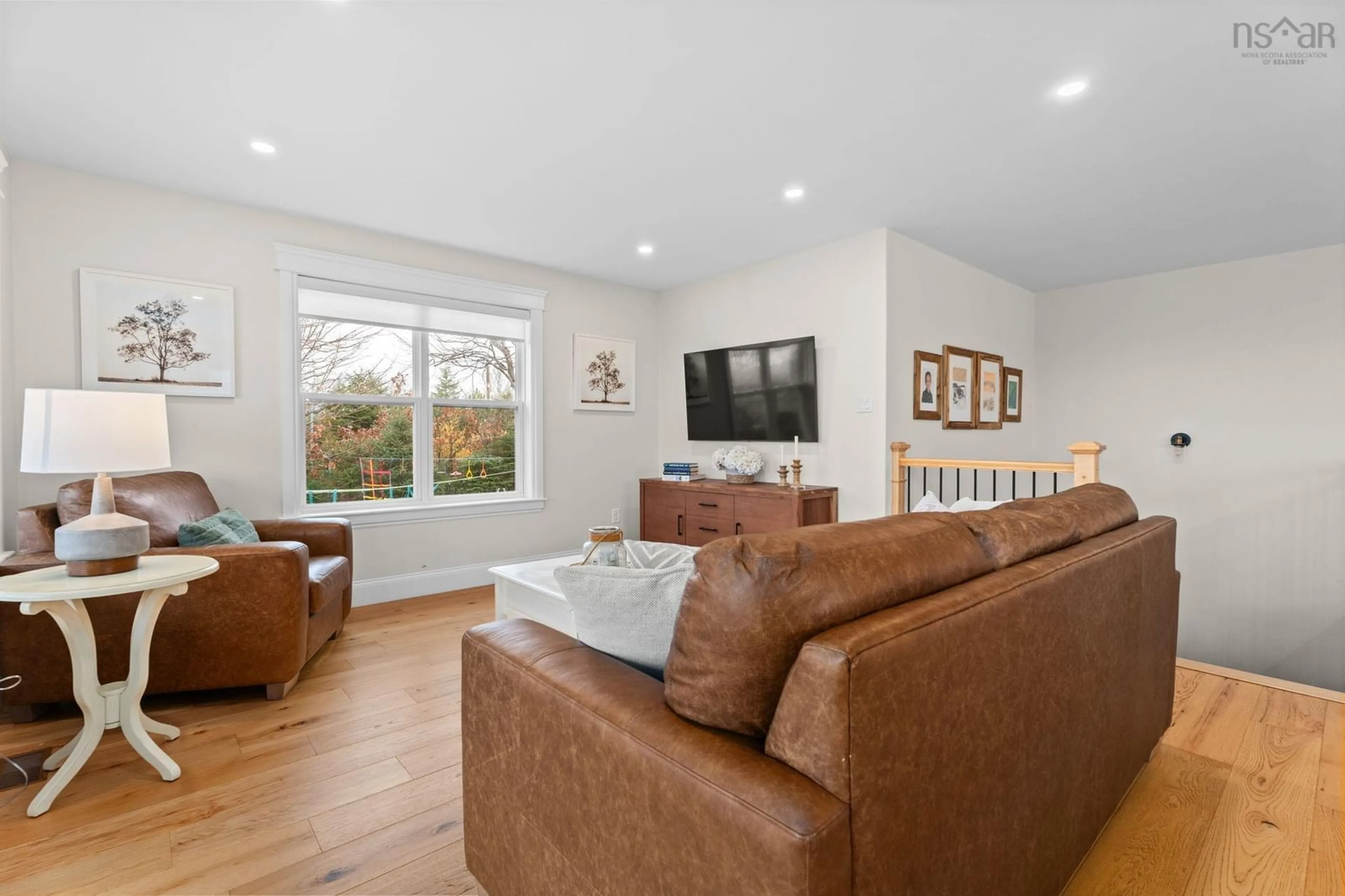 Living room with furniture, wood/laminate floor for 761 Ketch Harbour Rd, Portuguese Cove Nova Scotia B3V 1K2