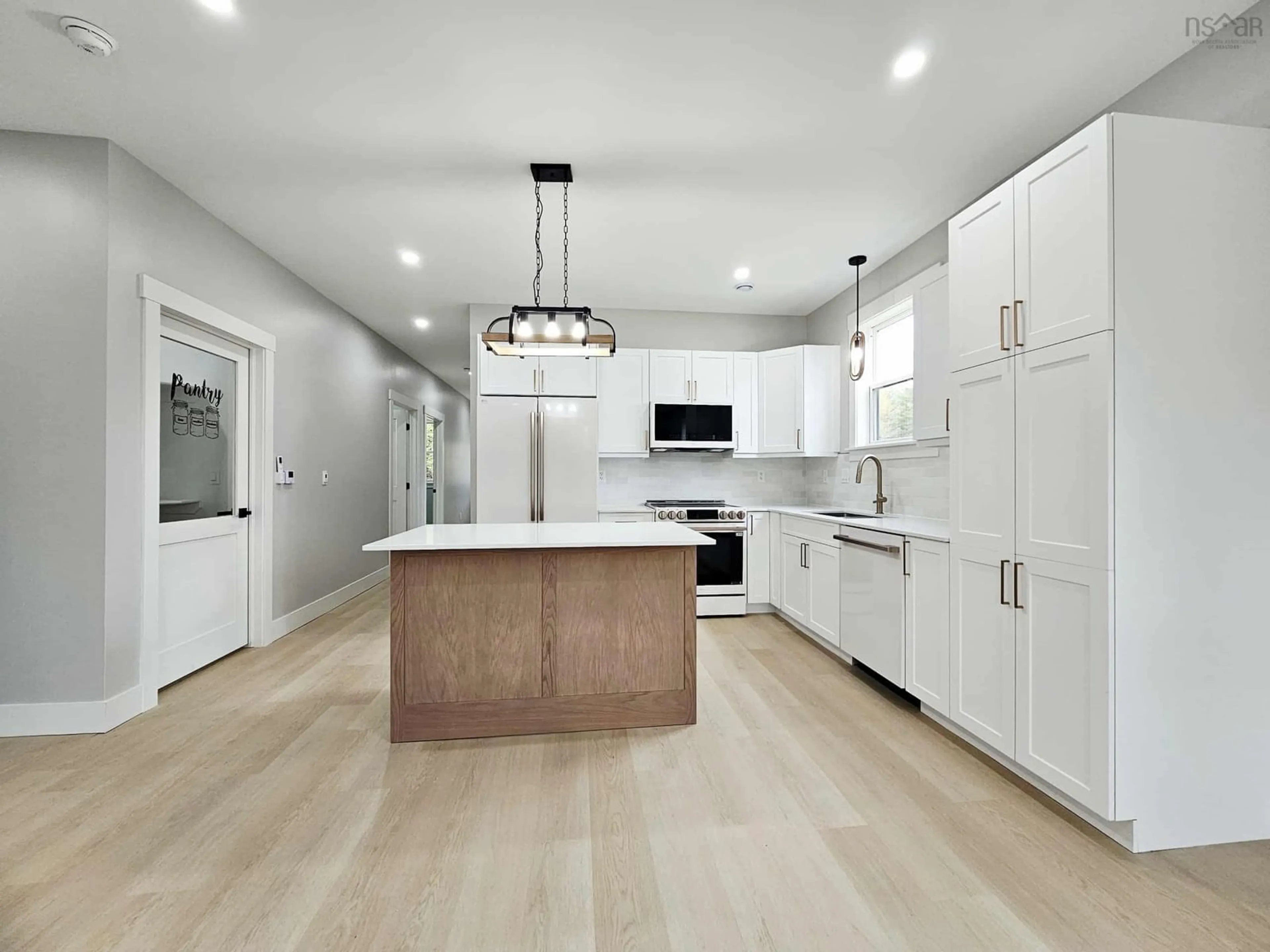 Open concept kitchen, wood/laminate floor for 29B Wild Rose Dr, East Mountain Nova Scotia B6L 2N3