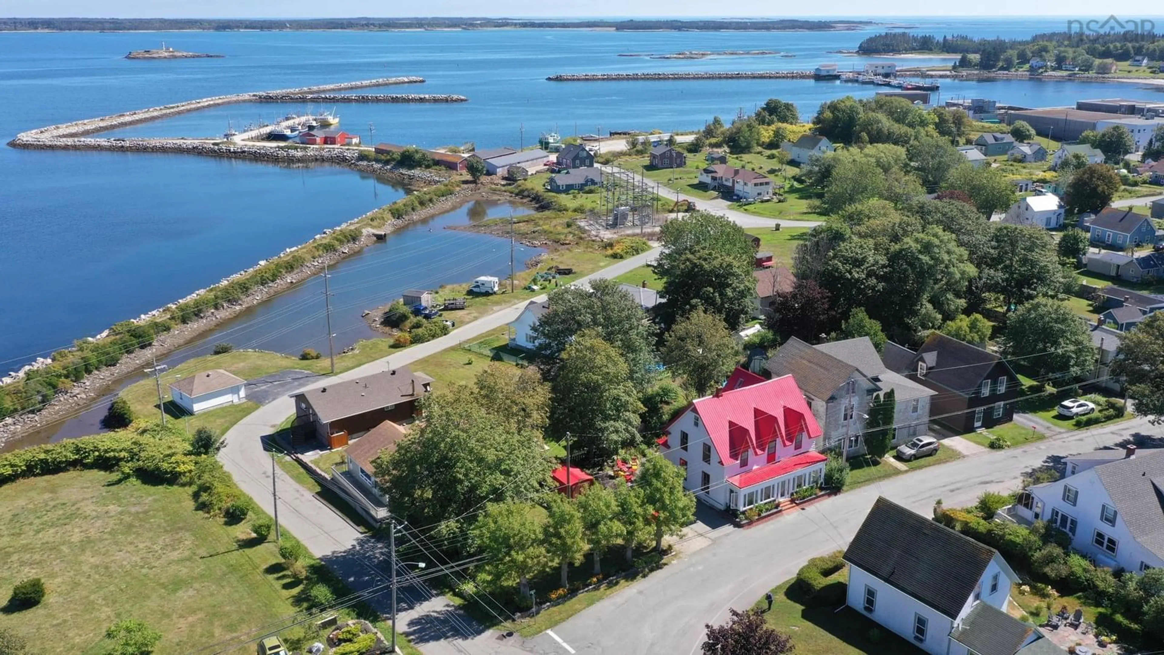 A pic from outside/outdoor area/front of a property/back of a property/a pic from drone, water/lake/river/ocean view for 132 Hall St, Lockeport Nova Scotia B0T 1L0