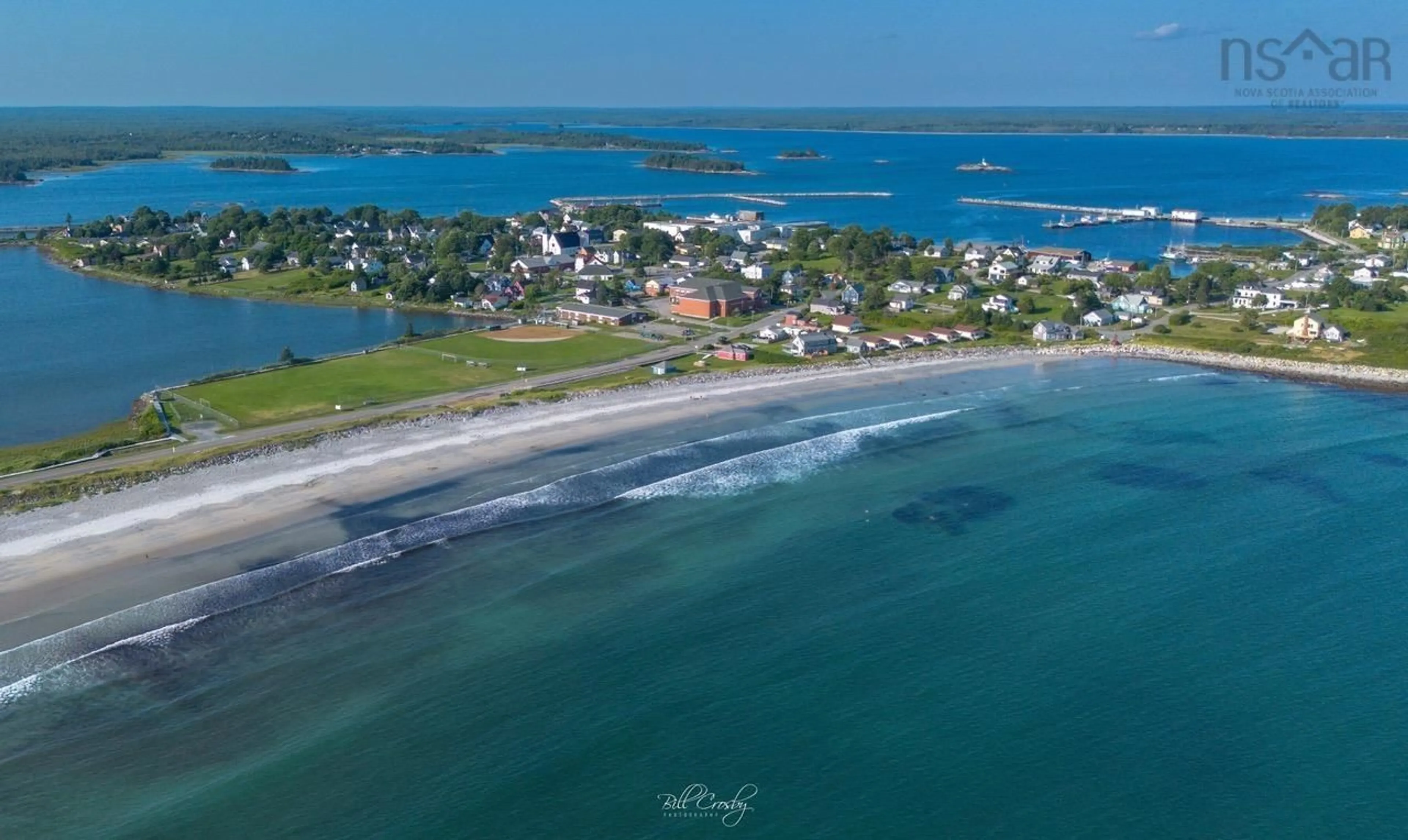 A pic from outside/outdoor area/front of a property/back of a property/a pic from drone, water/lake/river/ocean view for 132 Hall St, Lockeport Nova Scotia B0T 1L0