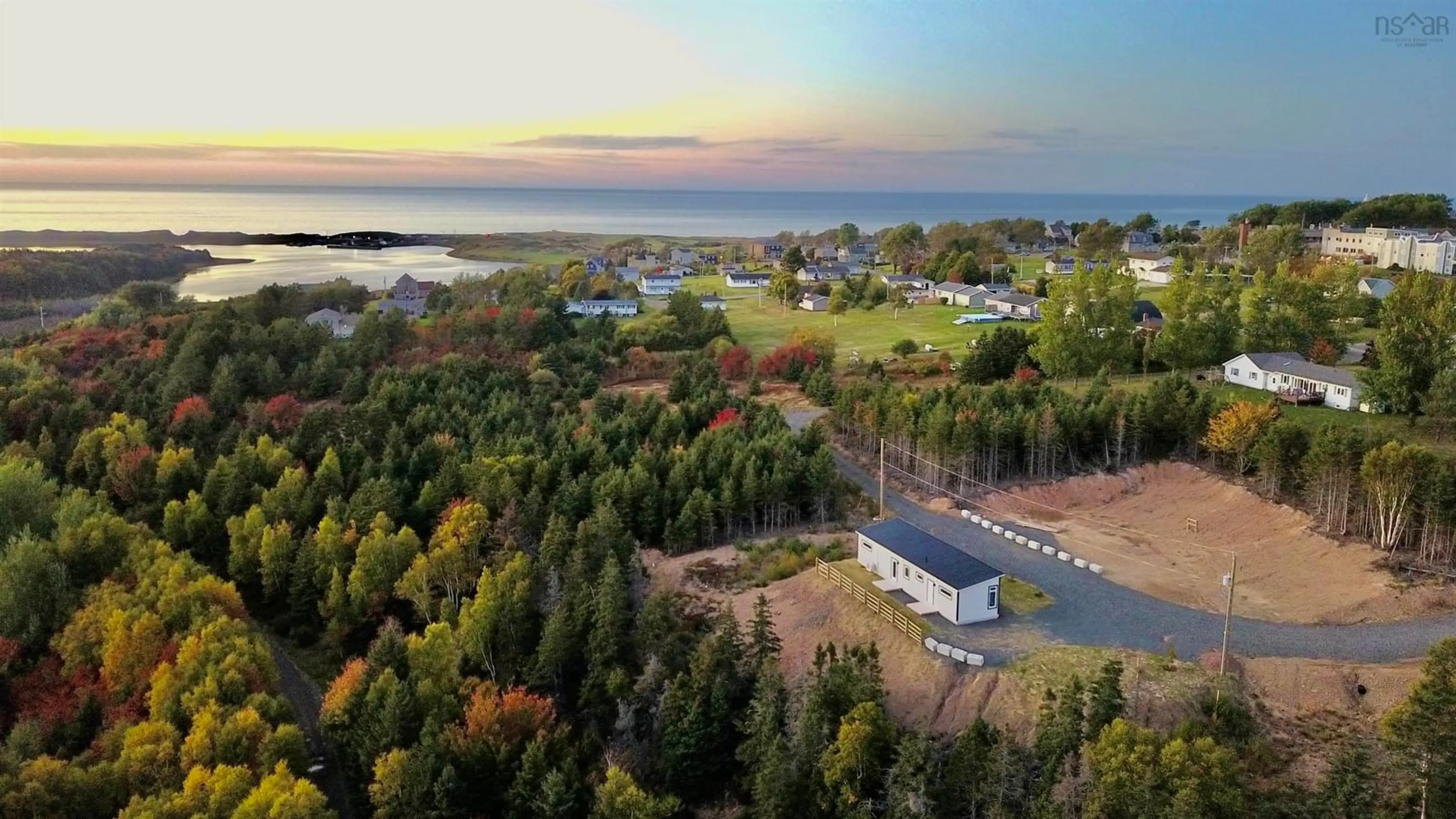 A pic from outside/outdoor area/front of a property/back of a property/a pic from drone, water/lake/river/ocean view for 25 Parkdale Cres, Inverness Nova Scotia B0E 1N0