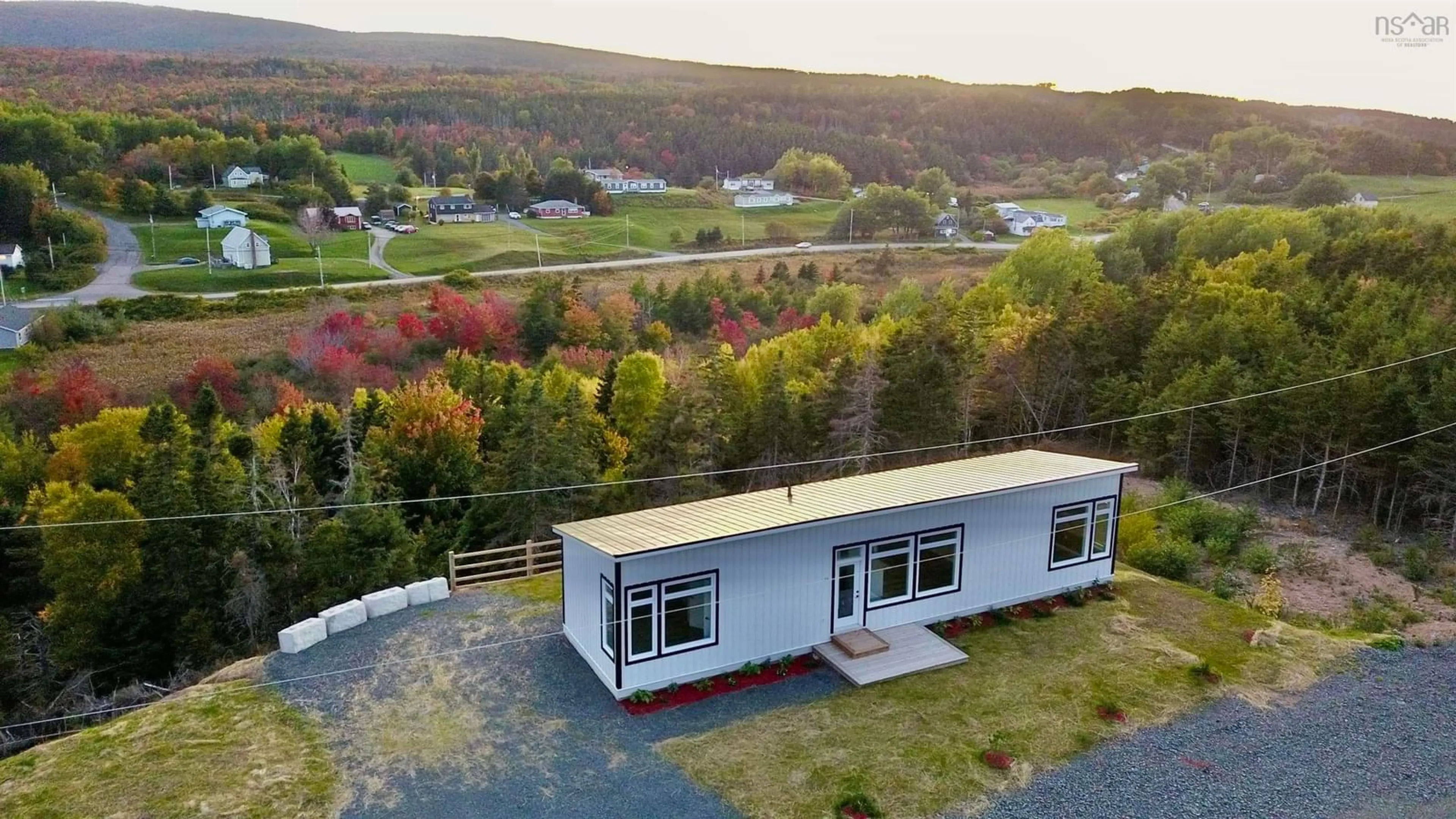 A pic from outside/outdoor area/front of a property/back of a property/a pic from drone, unknown for 25 Parkdale Cres, Inverness Nova Scotia B0E 1N0