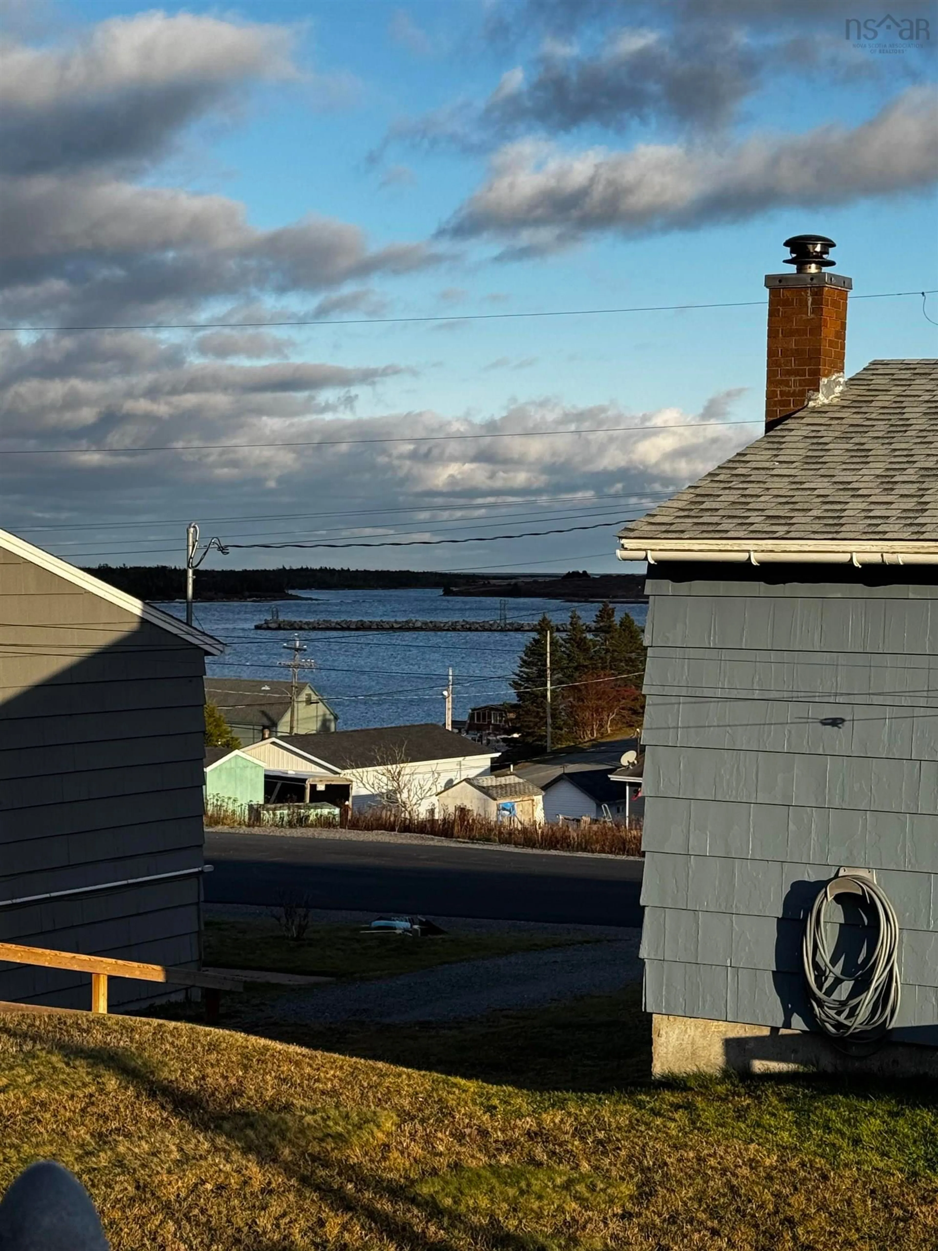 A pic from outside/outdoor area/front of a property/back of a property/a pic from drone, water/lake/river/ocean view for 53 Carleton Terr, Canso Nova Scotia B0H 1H0