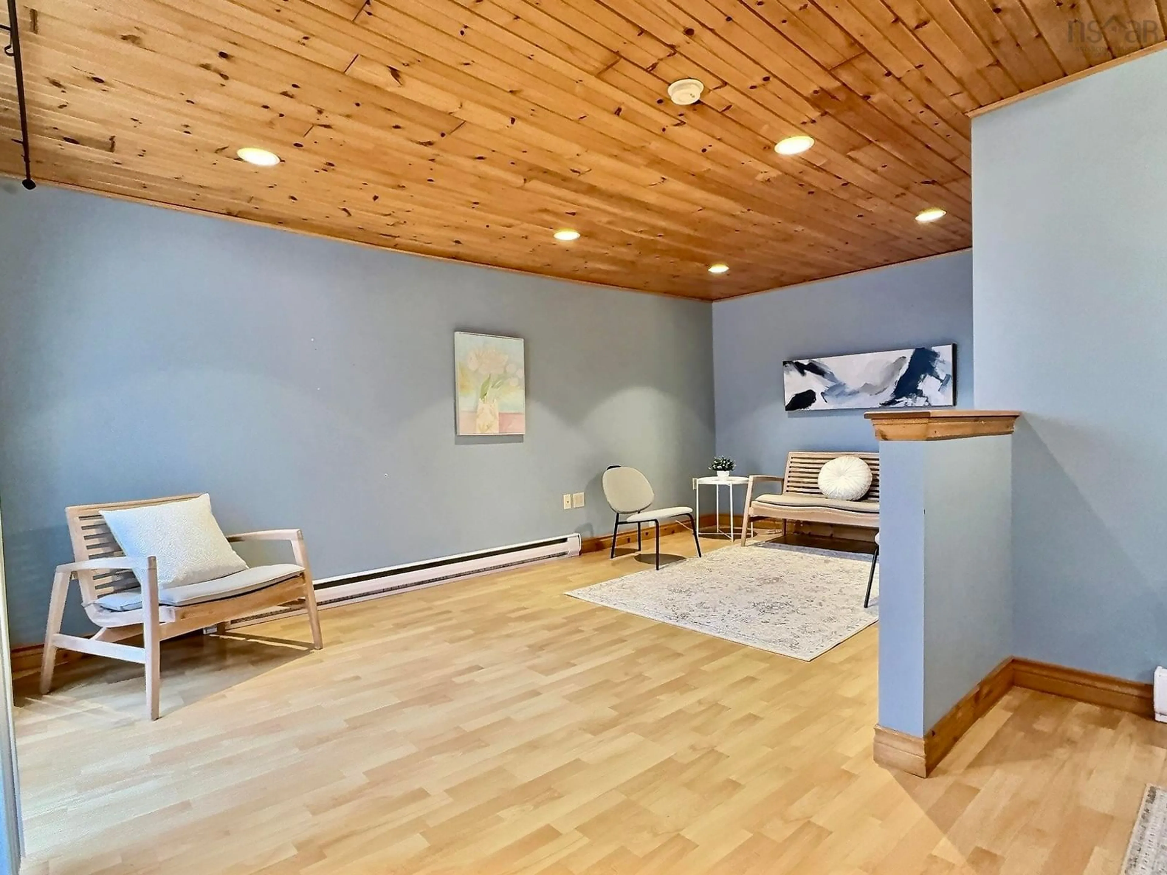 Living room with furniture, wood/laminate floor for 349 Lefort Rd, Plateau Nova Scotia B0E 1H0