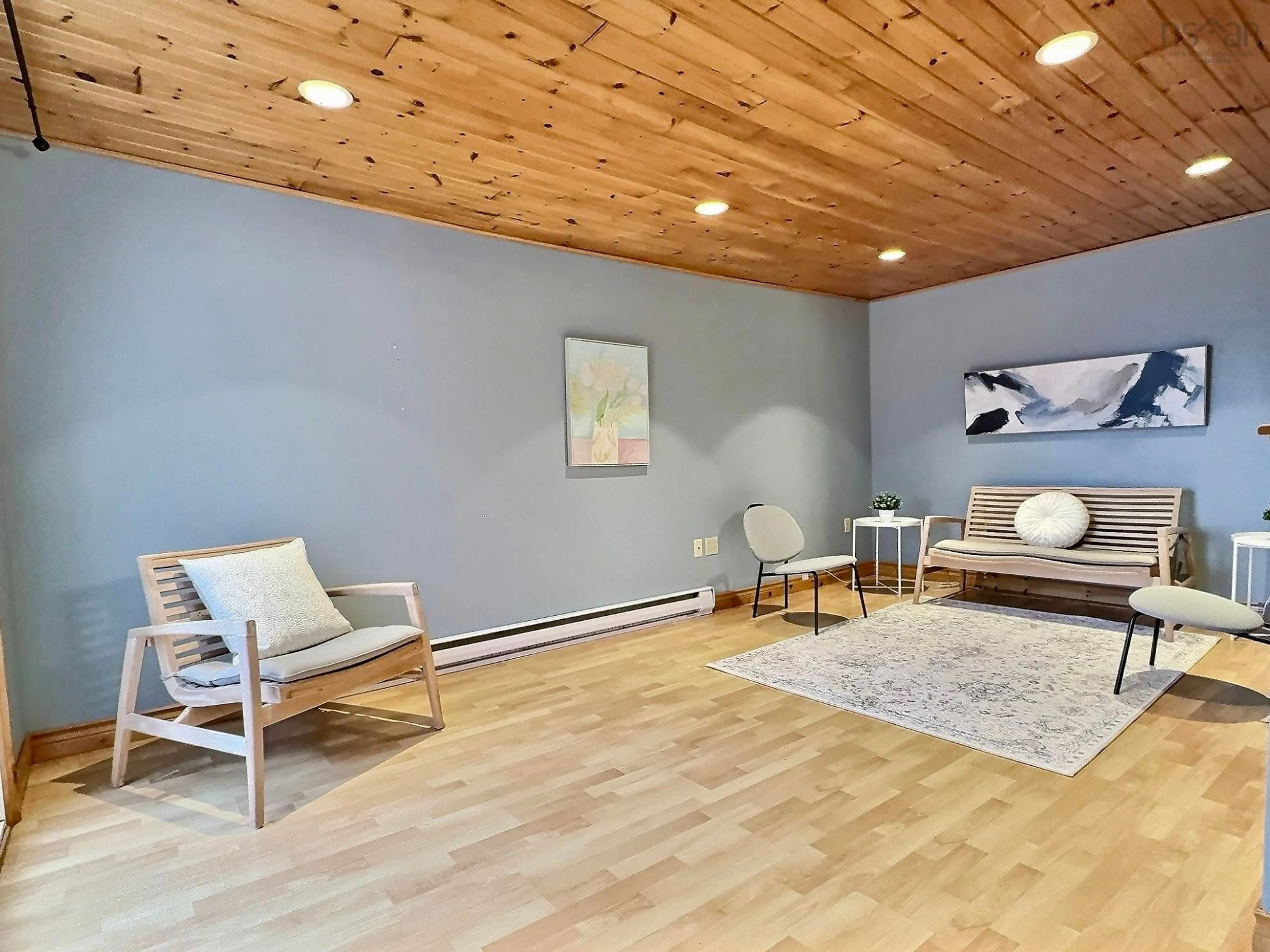 Living room with furniture, wood/laminate floor for 349 Lefort Rd, Plateau Nova Scotia B0E 1H0