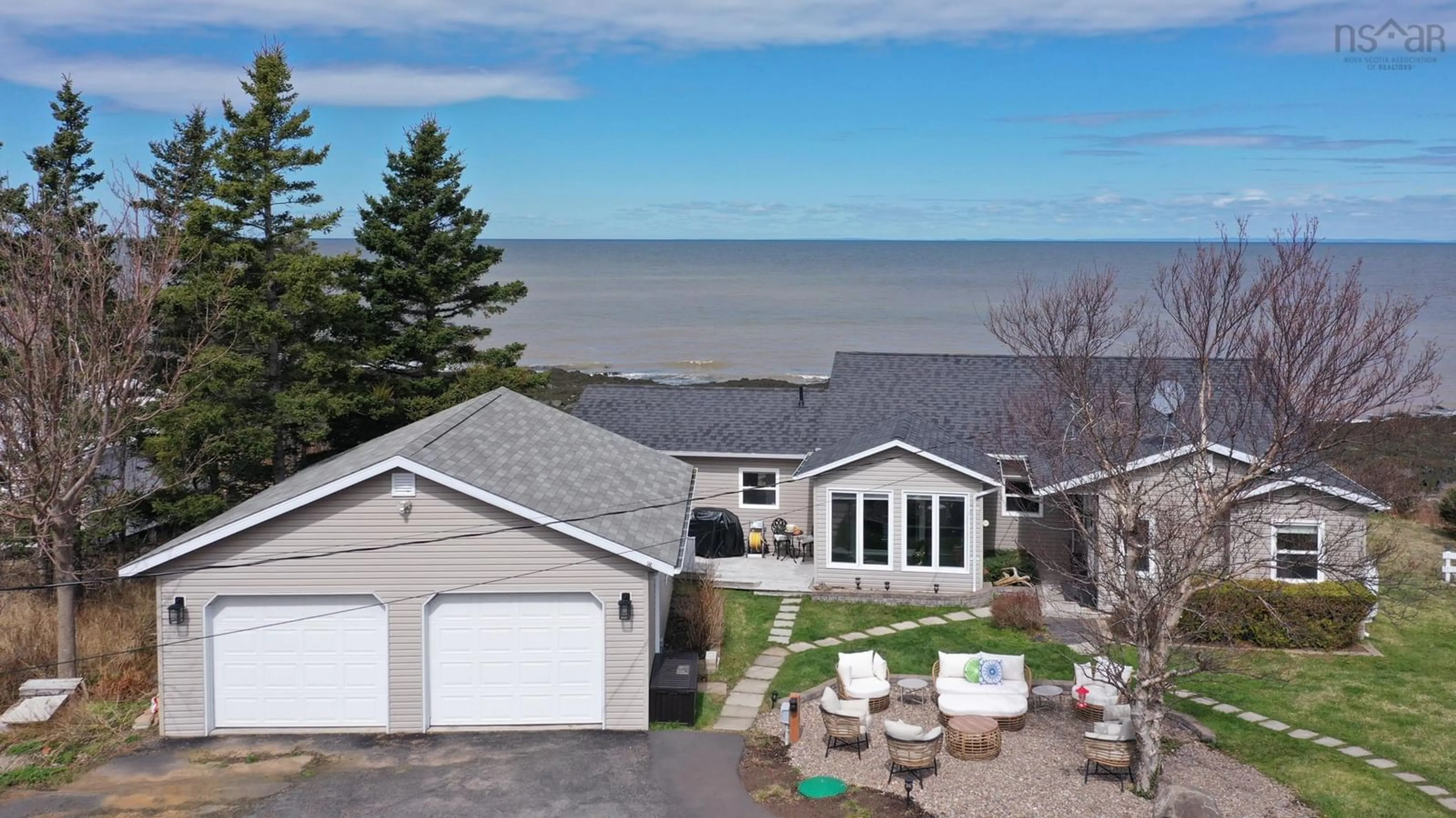 A pic from outside/outdoor area/front of a property/back of a property/a pic from drone, water/lake/river/ocean view for 59 Sunset Avenue, Phinneys Cove Nova Scotia B0S 1L0