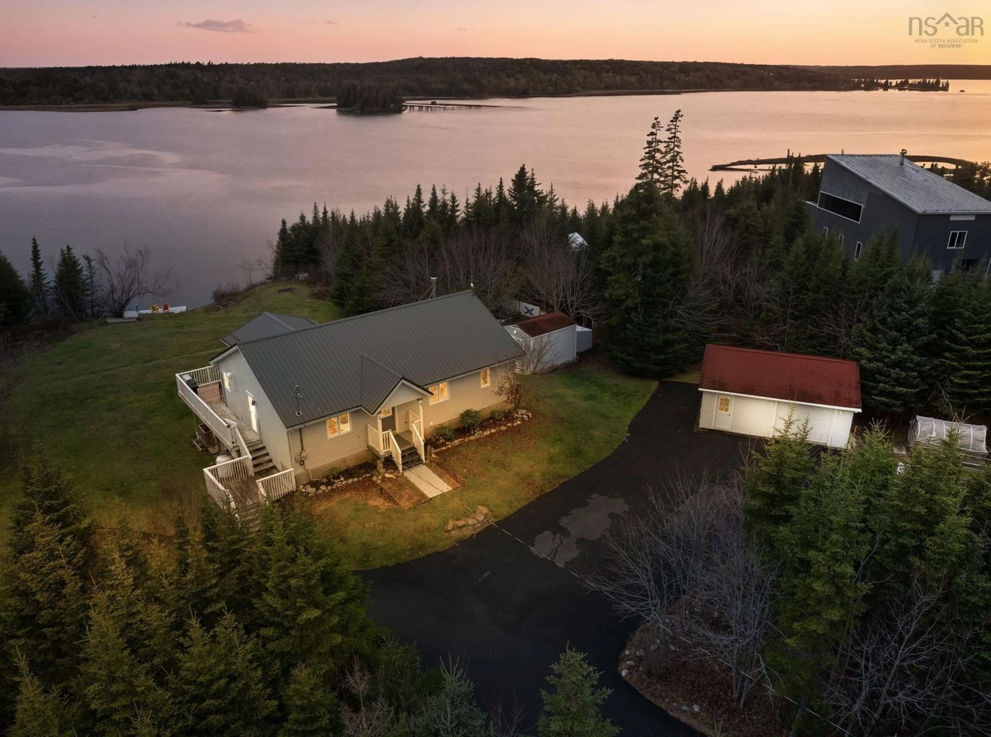 A pic from outside/outdoor area/front of a property/back of a property/a pic from drone, water/lake/river/ocean view for 38 Bastian Point Rd, East Lawrencetown Nova Scotia B2Z 1P8