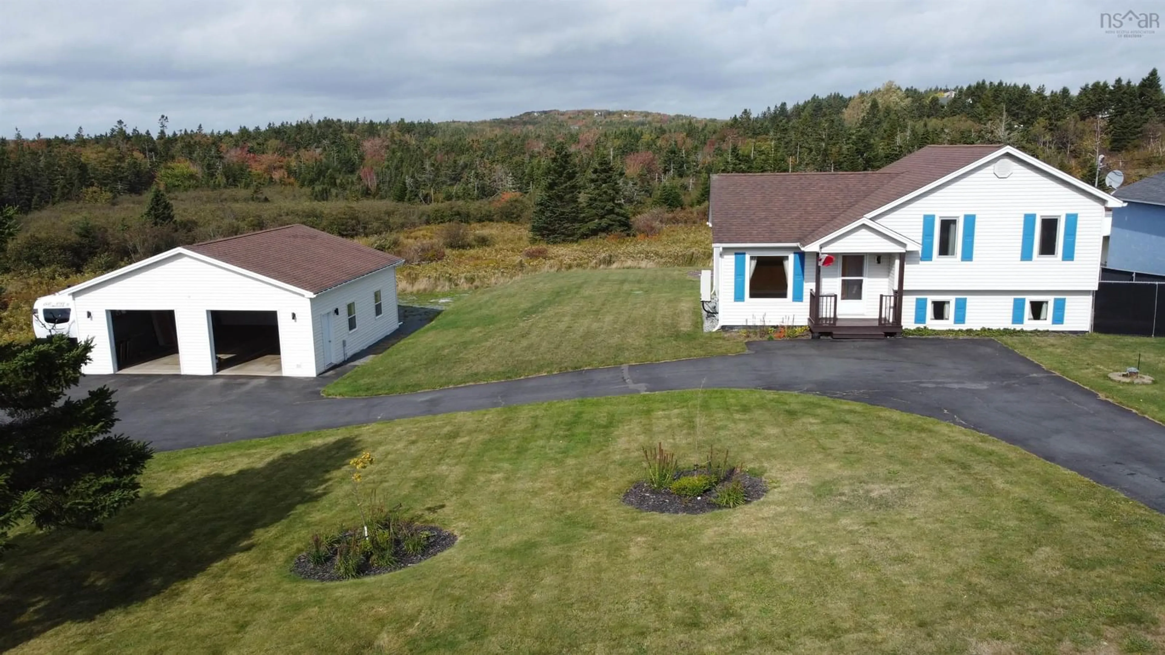 A pic from outside/outdoor area/front of a property/back of a property/a pic from drone, mountain view for 1534 Cow Bay Rd, Cow Bay Nova Scotia B3G 1L3