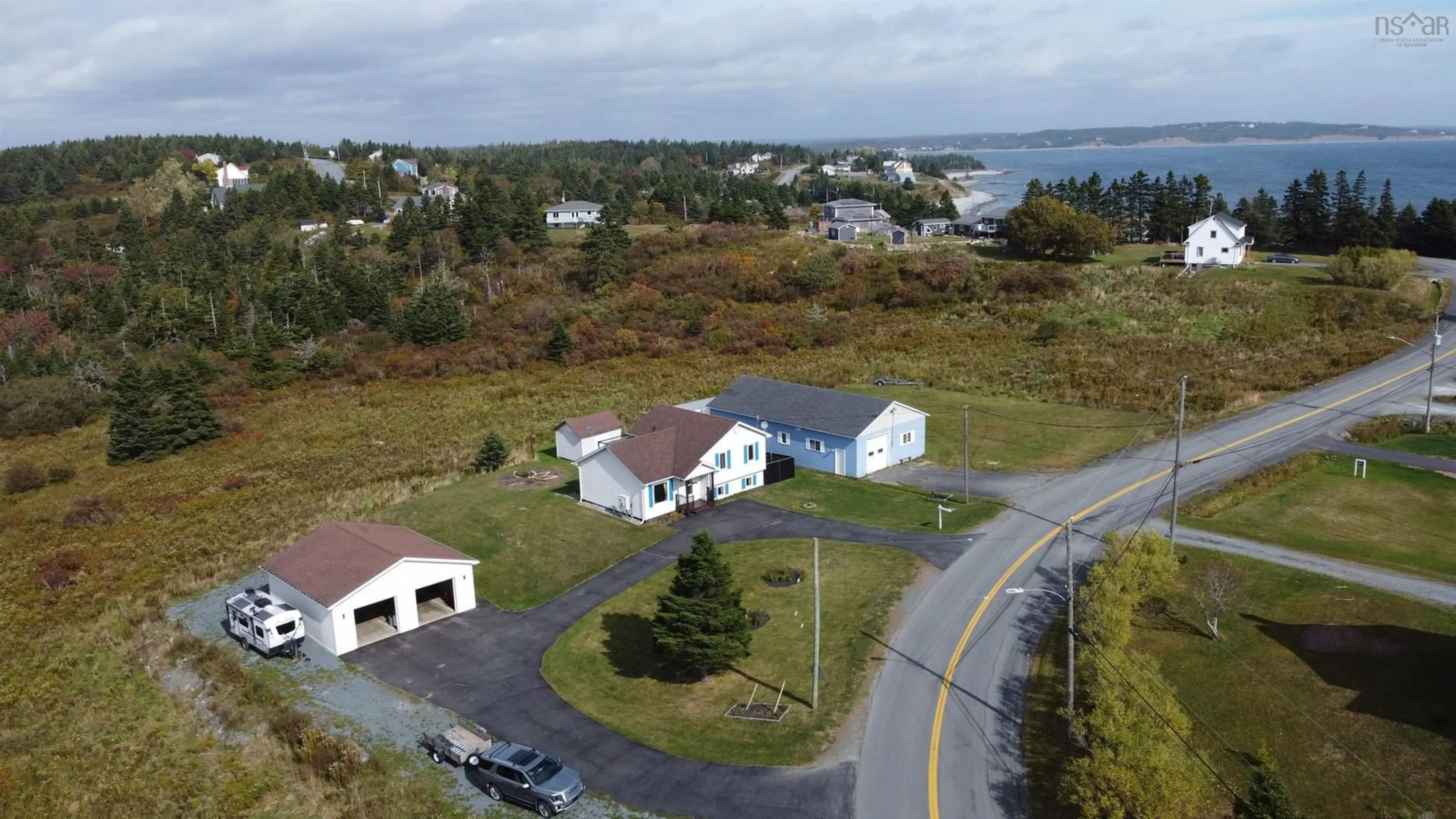 A pic from outside/outdoor area/front of a property/back of a property/a pic from drone, water/lake/river/ocean view for 1534 Cow Bay Rd, Cow Bay Nova Scotia B3G 1L3