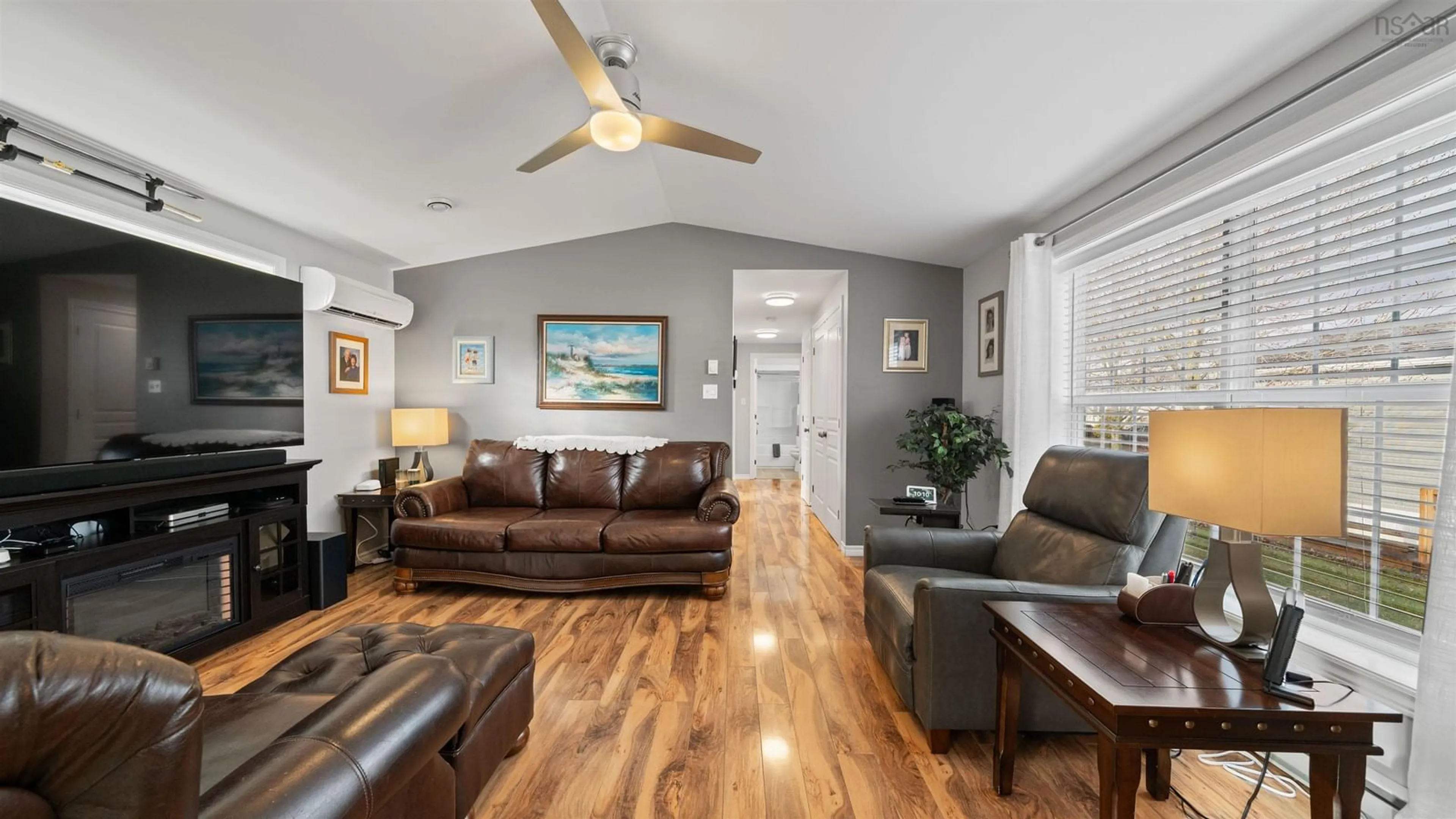 Living room with furniture, wood/laminate floor for 9 Merriweather Cres, Garlands Crossing Nova Scotia B0N 2T0