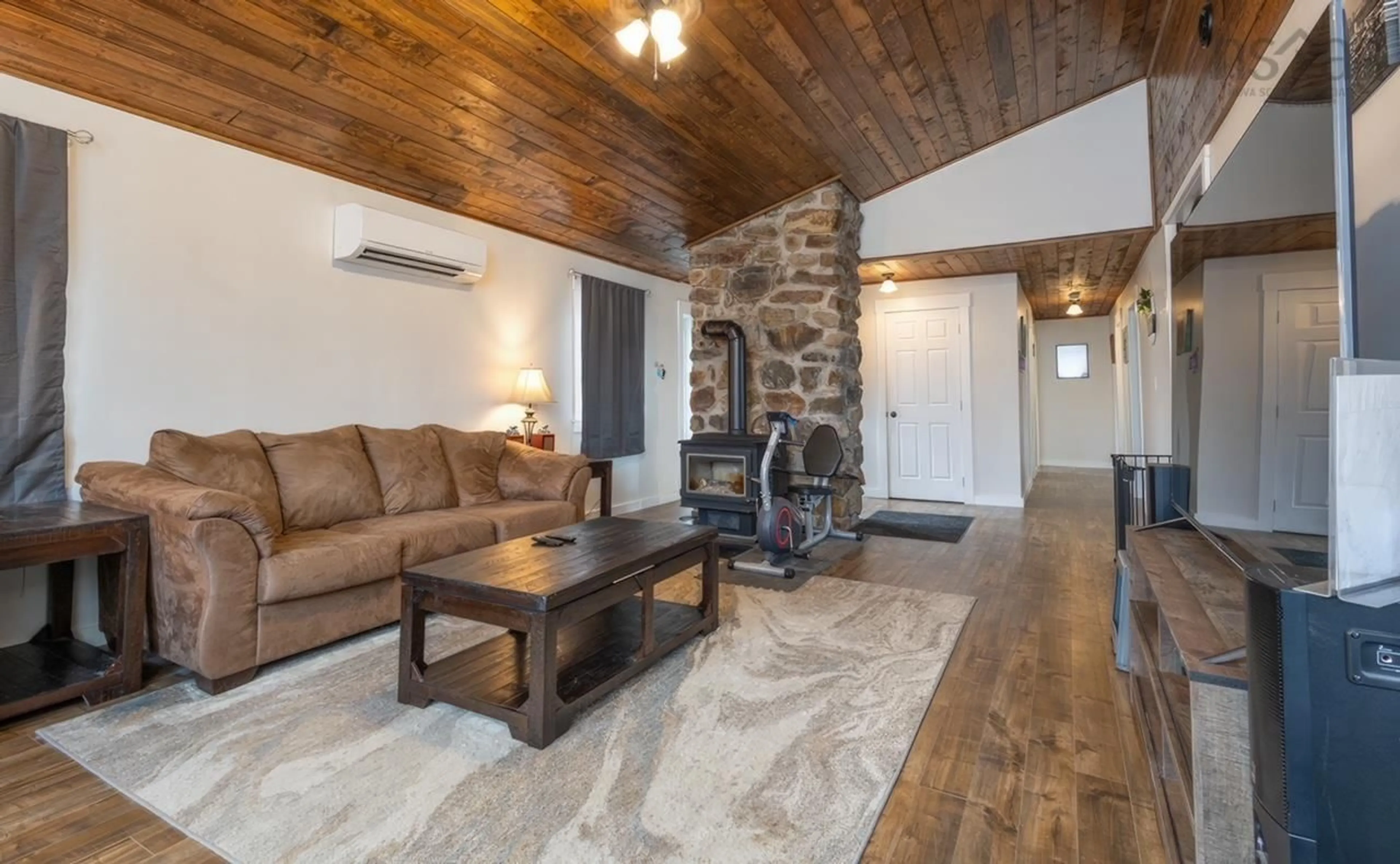Living room with furniture, wood/laminate floor for 62 Lake Doucette Rd, Lake Doucette Nova Scotia B0W 2Y0