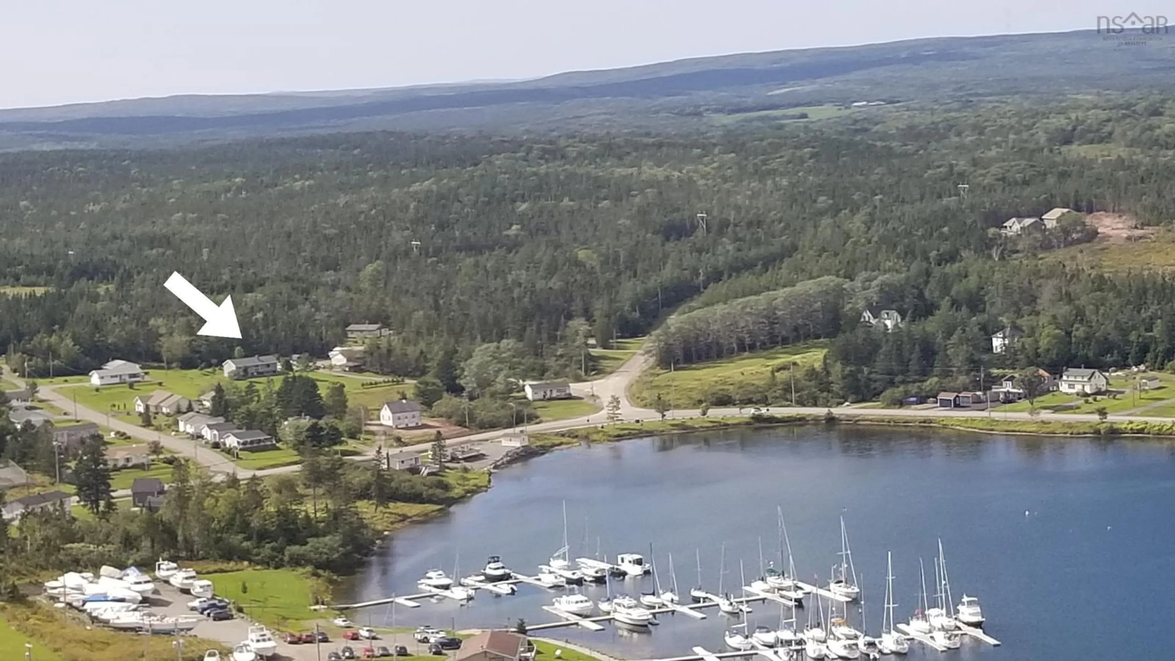 A pic from outside/outdoor area/front of a property/back of a property/a pic from drone, water/lake/river/ocean view for 110 De Raymond St, St. Peter's Nova Scotia B0E 3B0