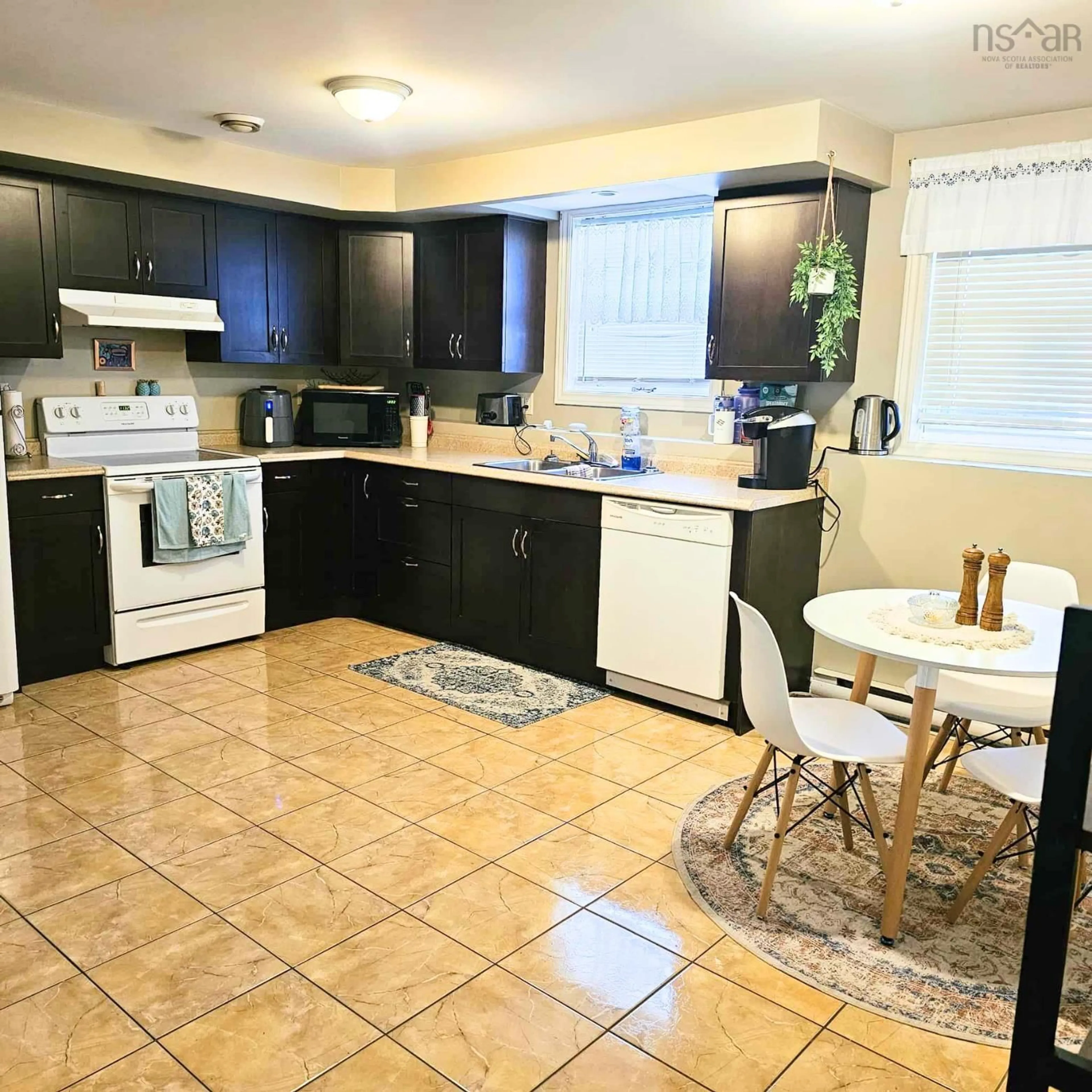 Open concept kitchen, ceramic/tile floor for 135-137 Brook St, North Sydney Nova Scotia B2A 3R4