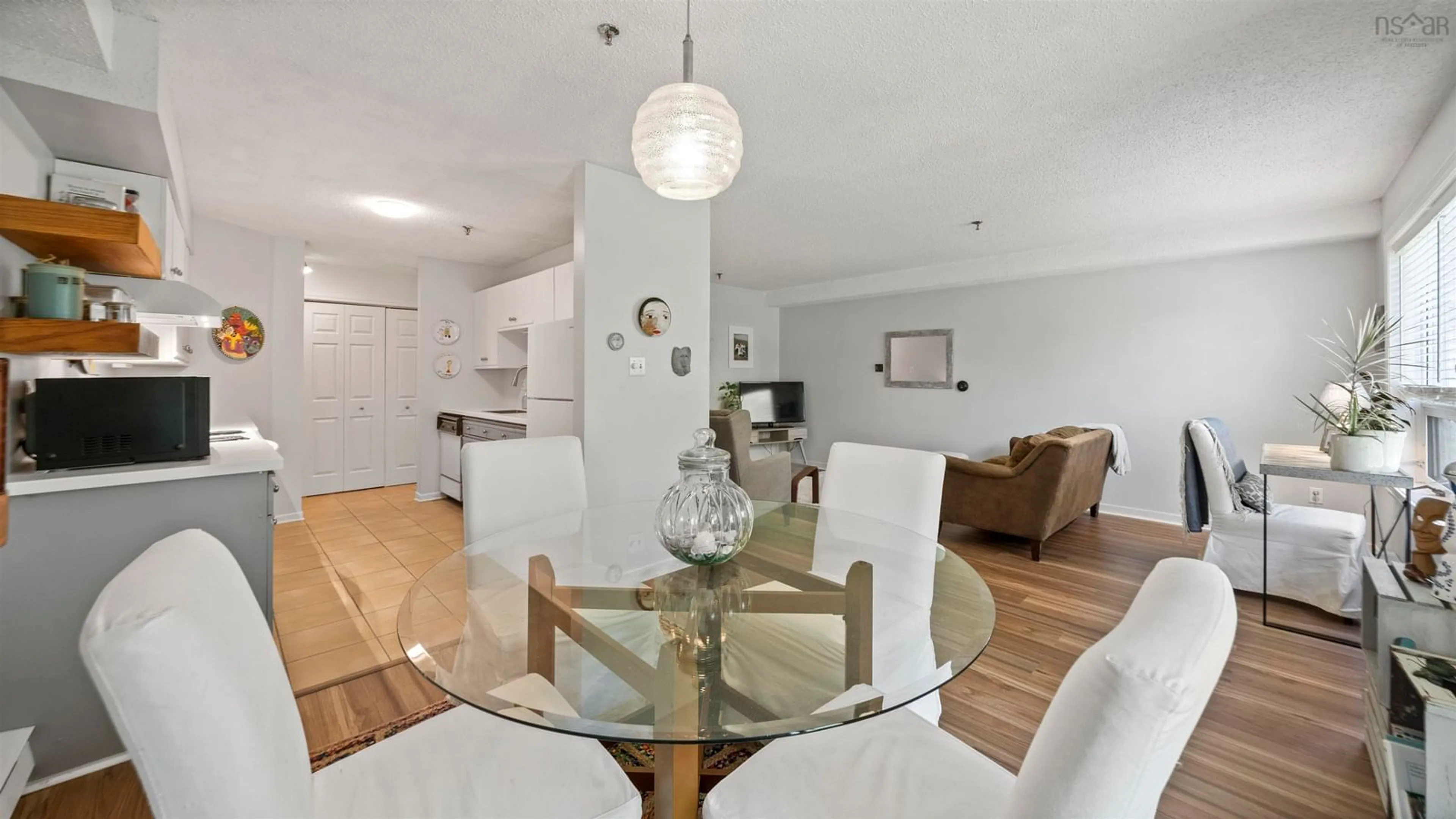 Living room with furniture, wood/laminate floor for 51 Wimbledon Rd #113, Bedford Nova Scotia B4A 3M7