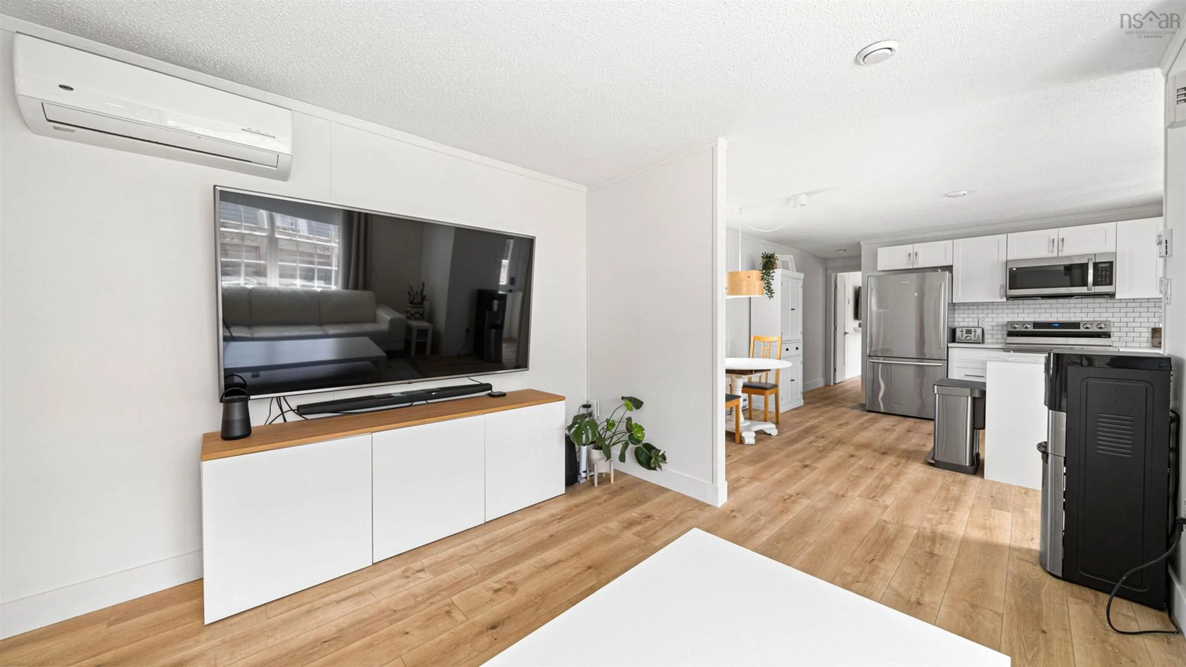 Open concept kitchen, wood/laminate floor for 10 Bellwood Dr, Harrietsfield Nova Scotia B3V 1A6