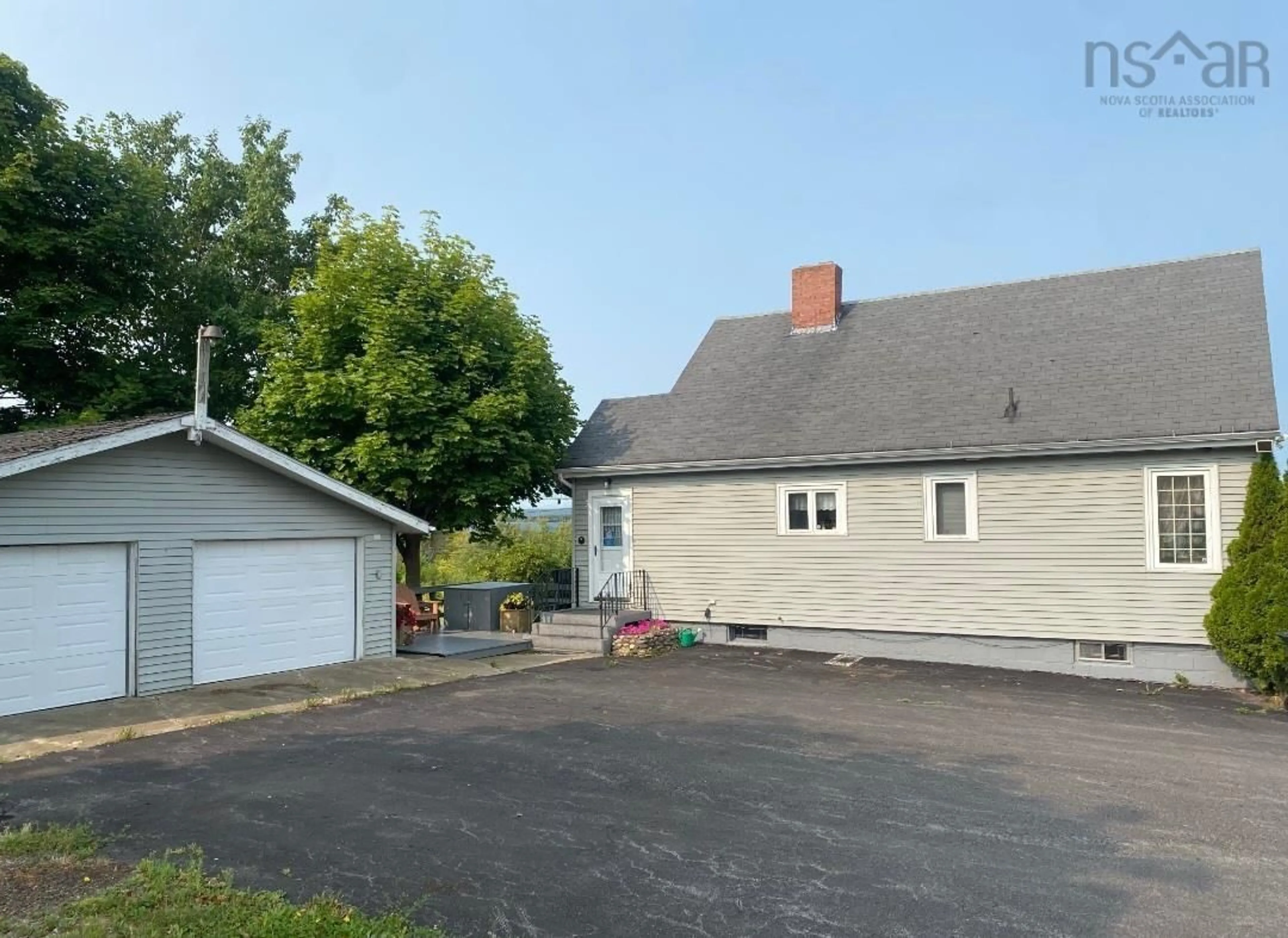 A pic from outside/outdoor area/front of a property/back of a property/a pic from drone, street for 399 Church Rd, Little Bras D'Or Nova Scotia B1Y 3A3