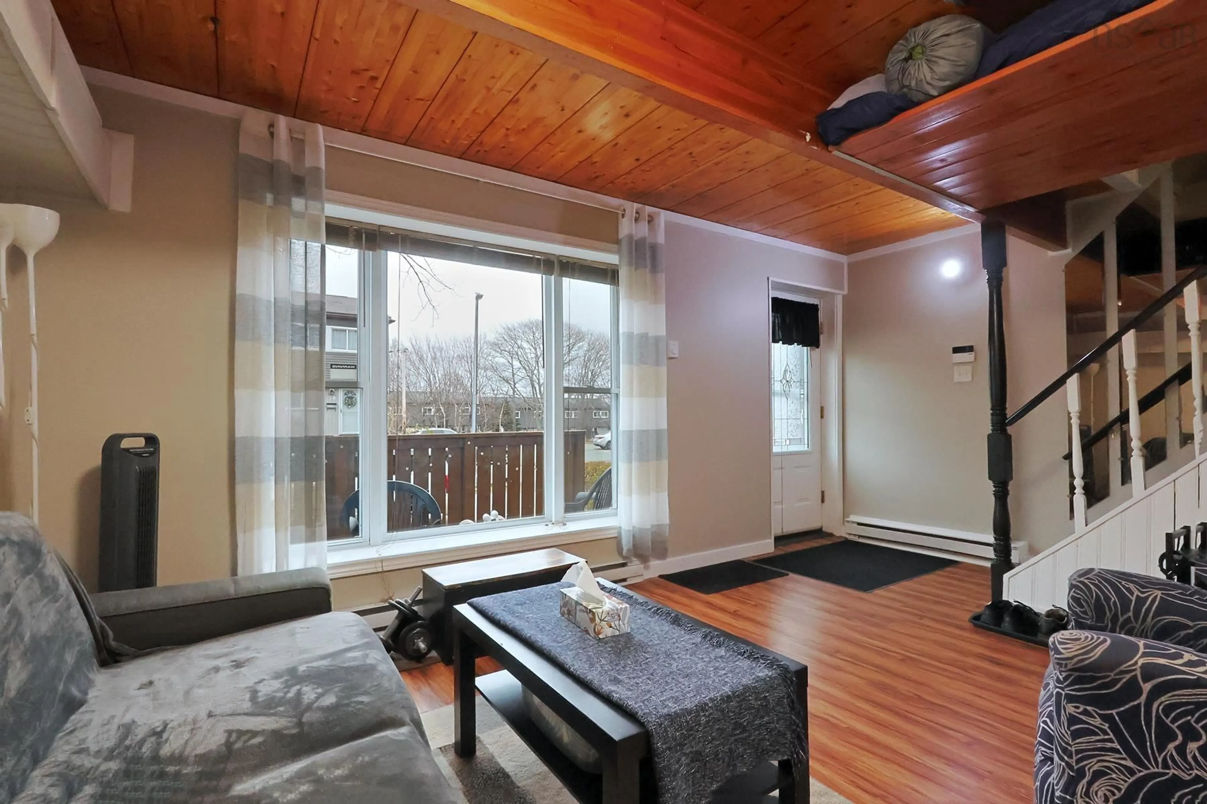 Living room with furniture, wood/laminate floor for 78 Bromley Rd, Spryfield Nova Scotia B3P 2L7