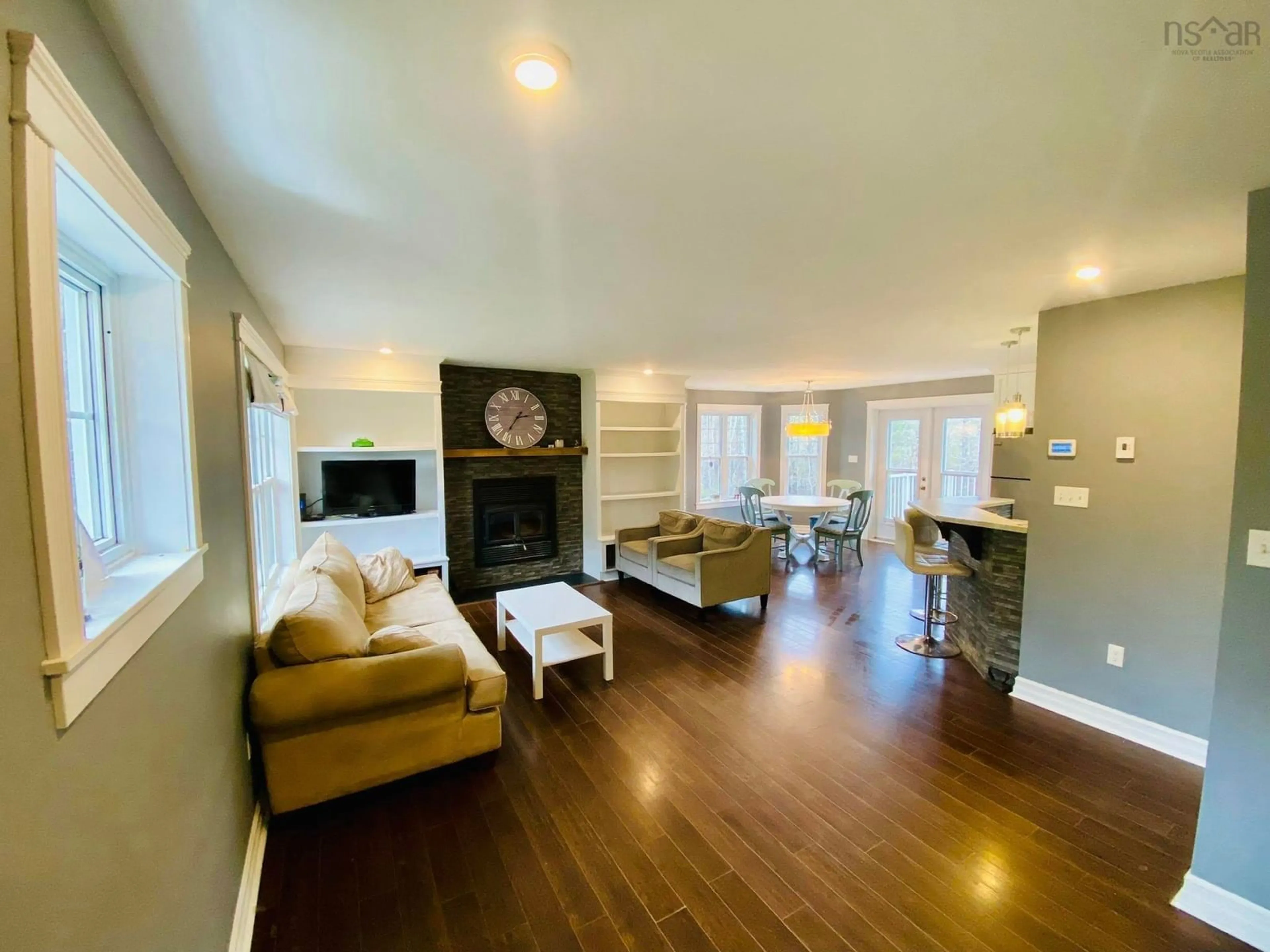 Living room with furniture, wood/laminate floor for 157 Meldrum Ave, Conquerall Bank Nova Scotia B4V 8V6