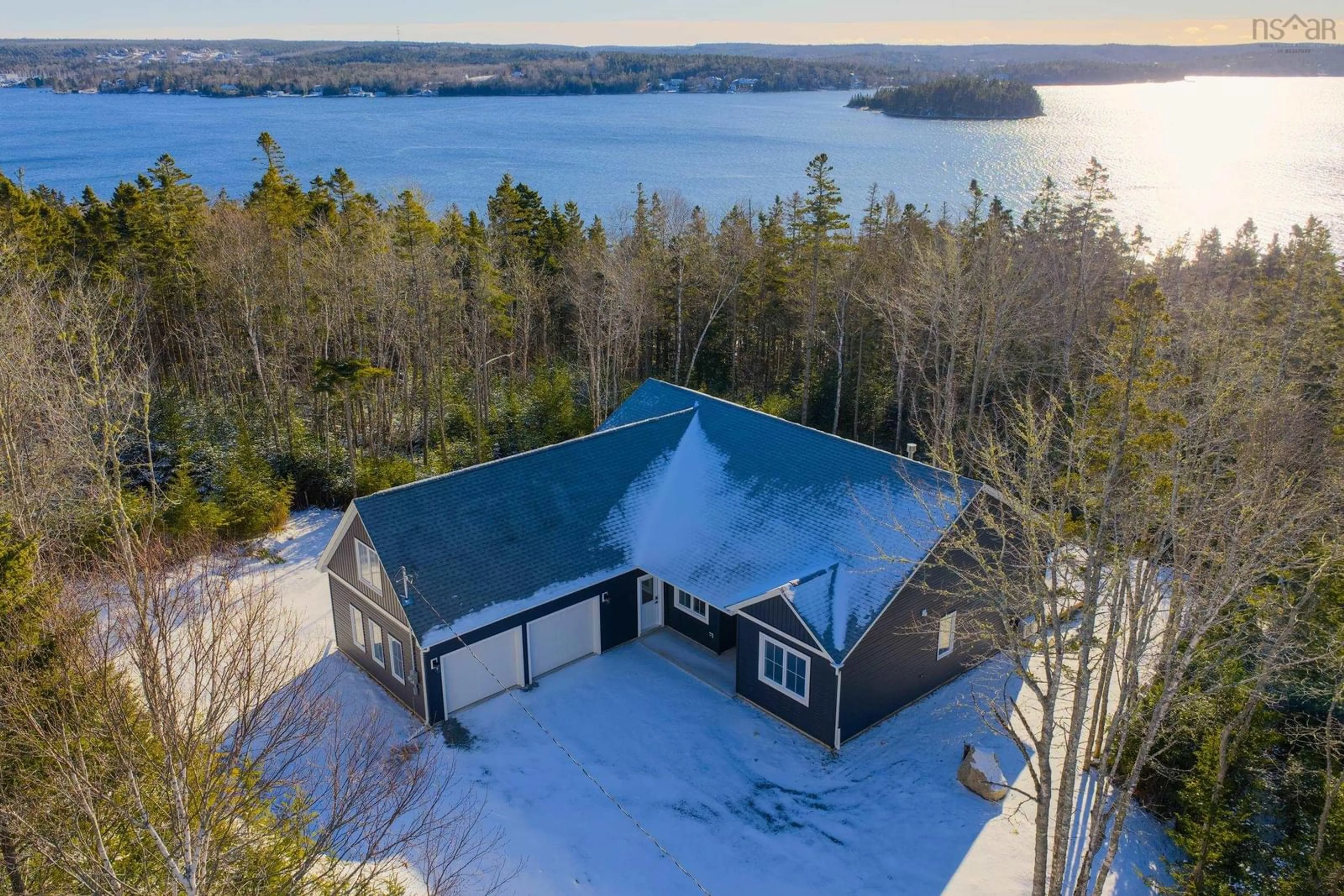 A pic from outside/outdoor area/front of a property/back of a property/a pic from drone, water/lake/river/ocean view for 85 Hillside Dr, Boutiliers Point Nova Scotia B3Z 1W9