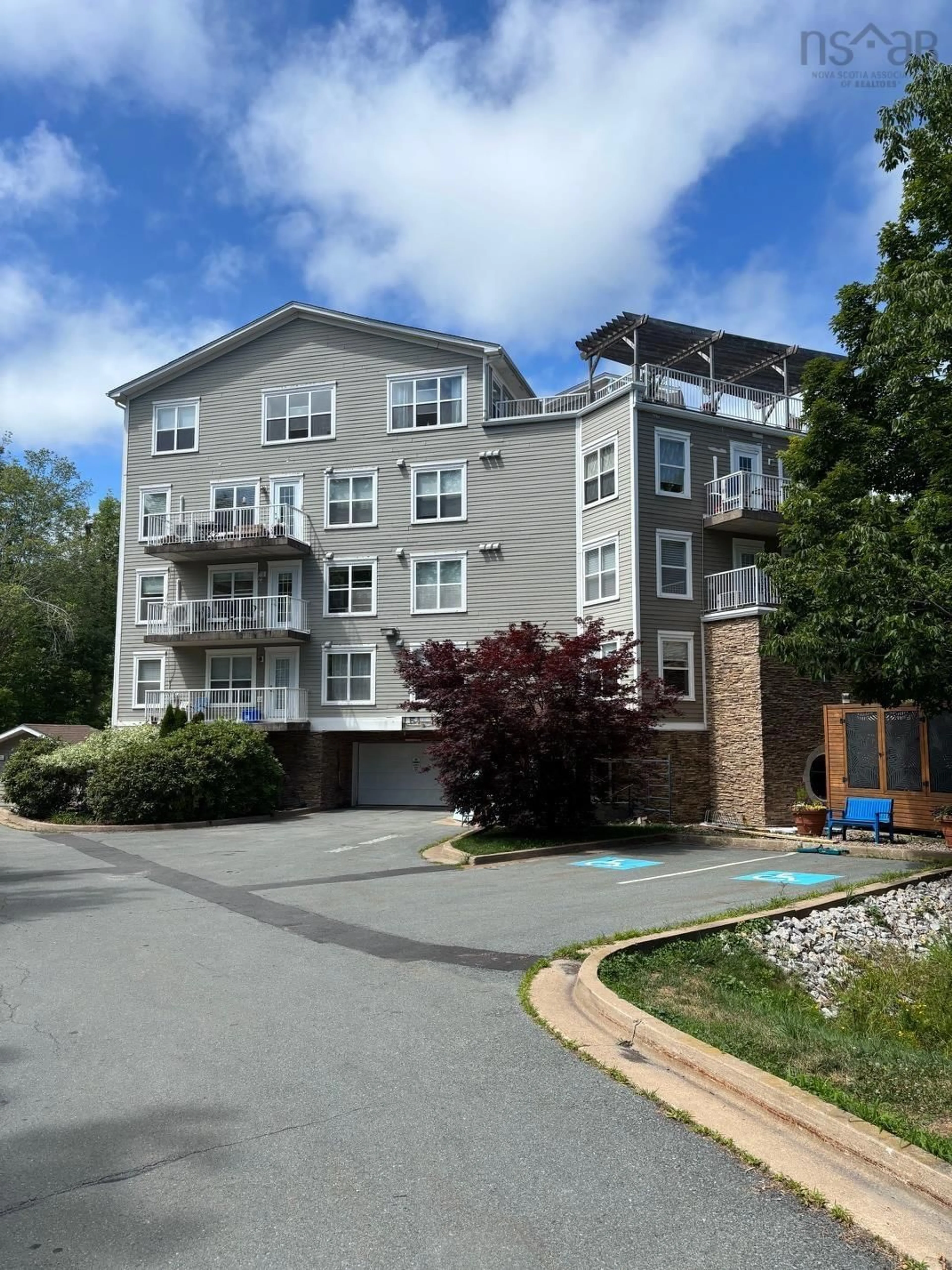 A pic from outside/outdoor area/front of a property/back of a property/a pic from drone, unknown for 476 Main St #304, Mahone Bay Nova Scotia B0J 2E0