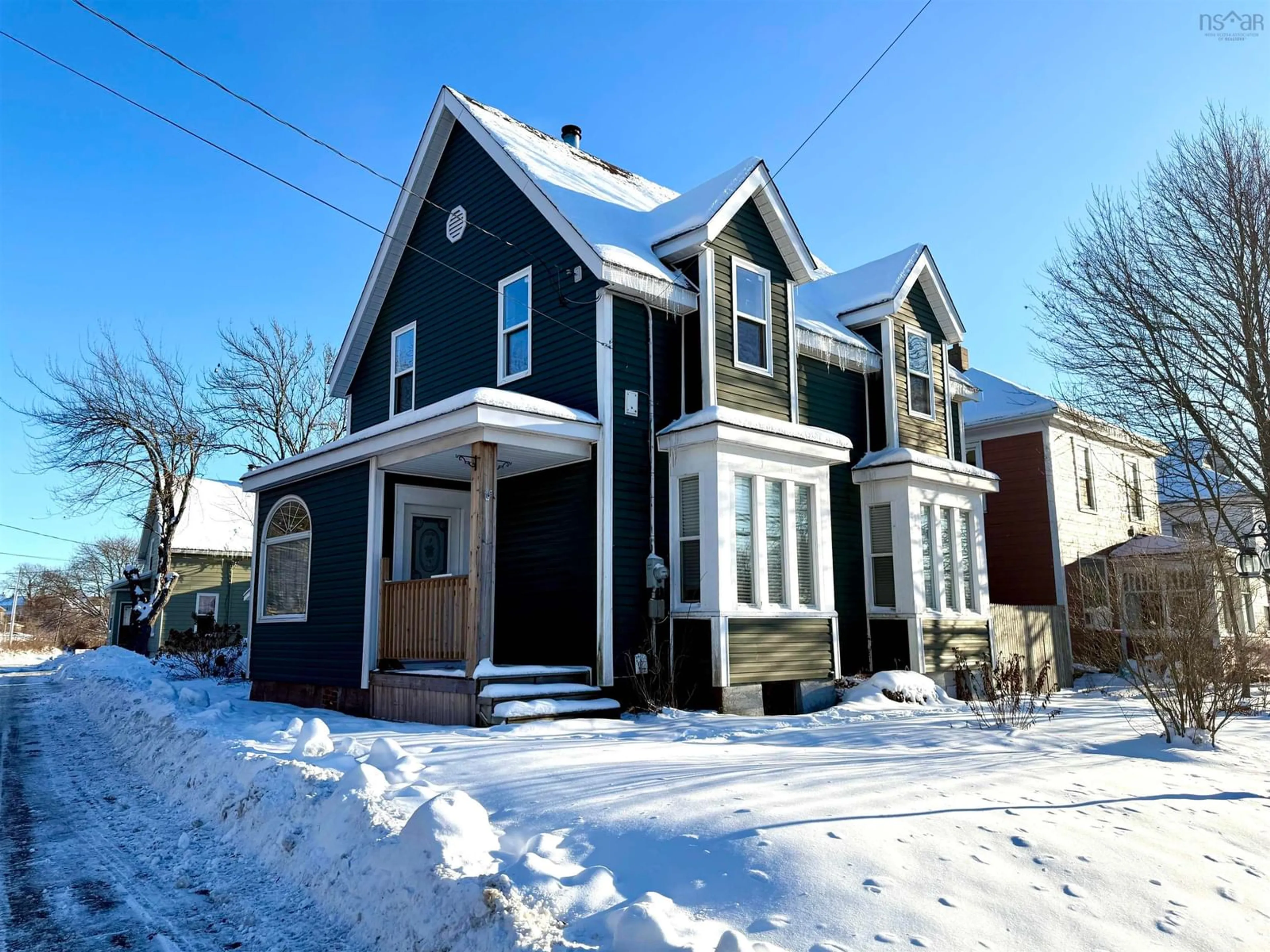 Home with vinyl exterior material, street for 50 Victoria St, Amherst Nova Scotia B4H 1C4