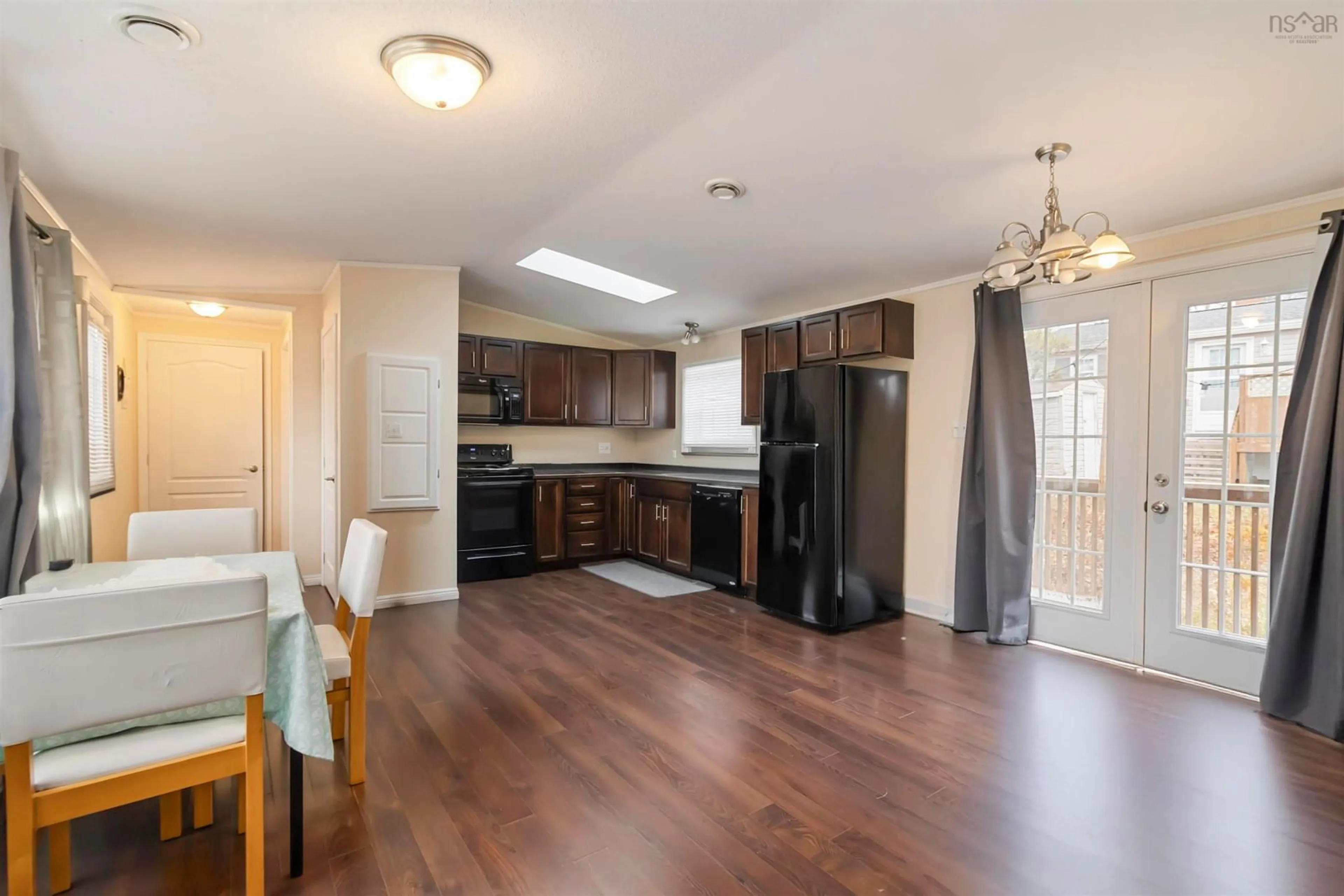 Open concept kitchen, wood/laminate floor for 23 Paget Lane, Dartmouth Nova Scotia B3A 0G2