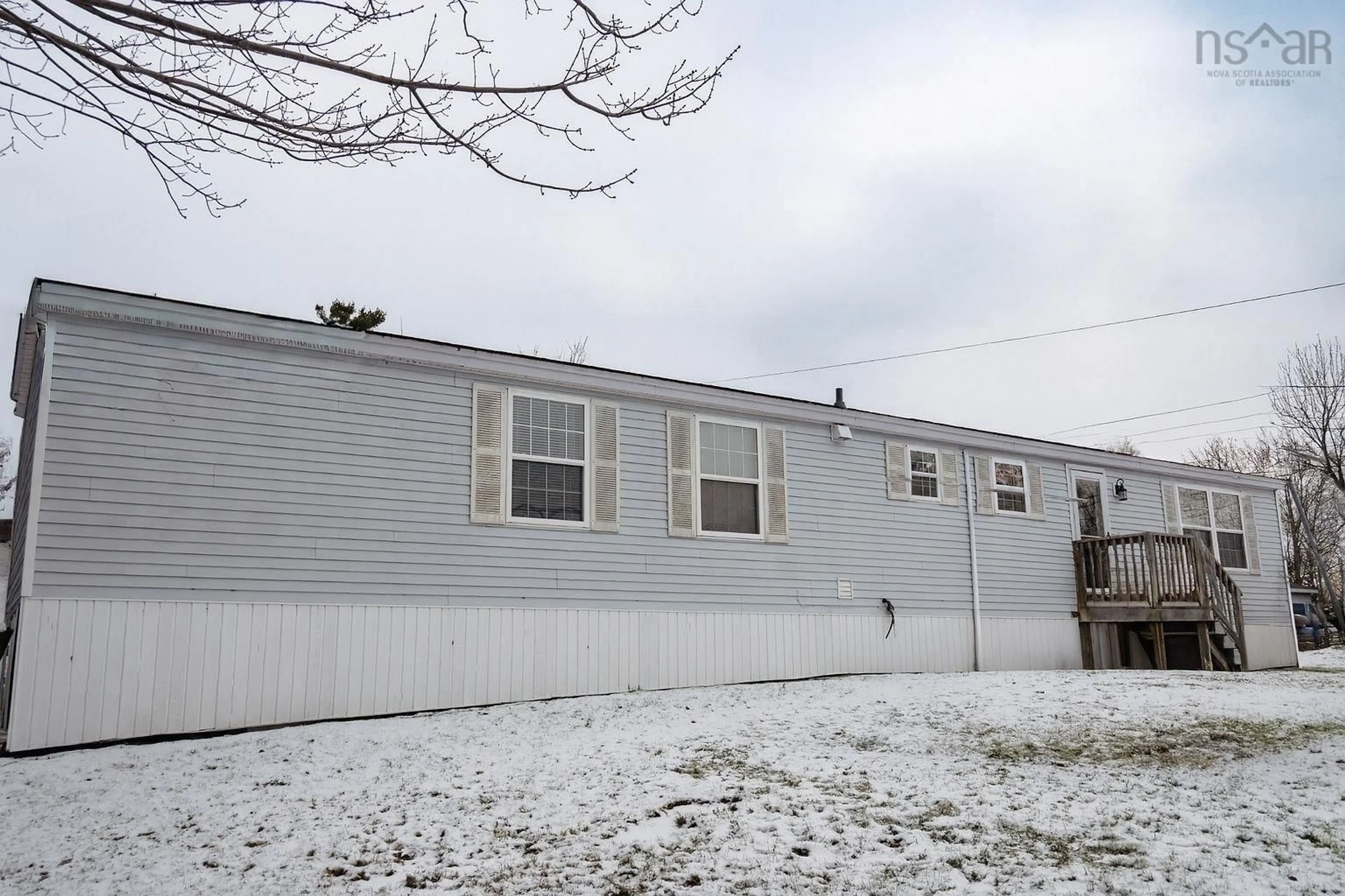 Home with vinyl exterior material, street for 17 Cook Dr, East River Nova Scotia B0J 1T0