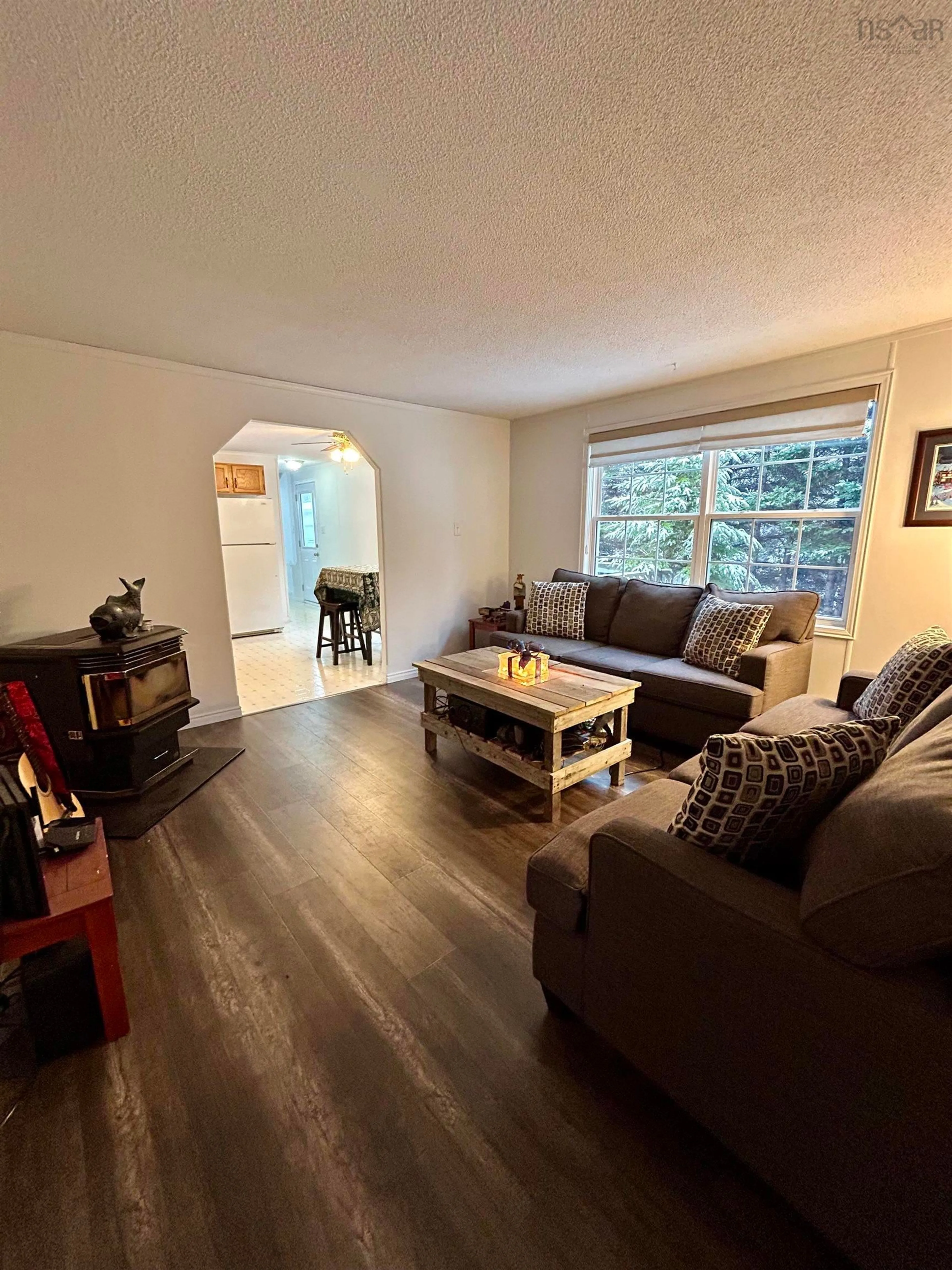Living room with furniture, wood/laminate floor for 18 Lois Lane, Simms Settlement Nova Scotia B3P 2T3