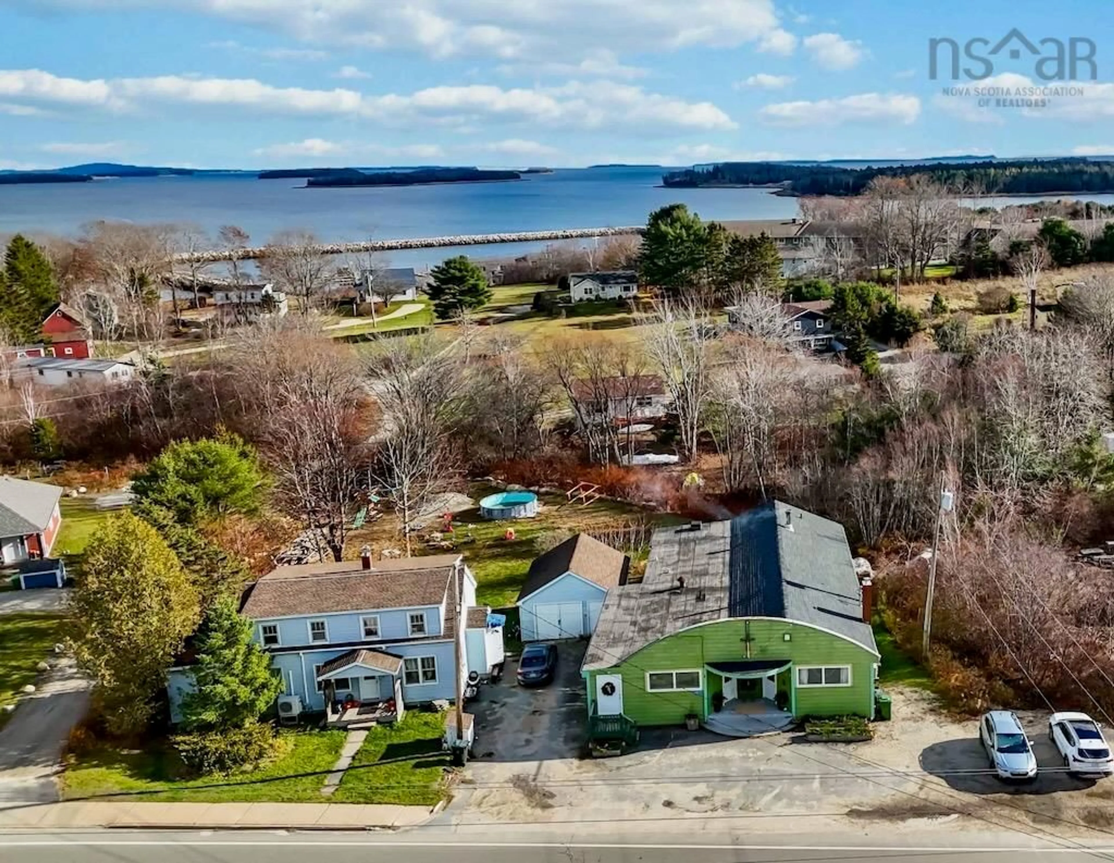 A pic from outside/outdoor area/front of a property/back of a property/a pic from drone, water/lake/river/ocean view for 6517 Highway 3, Western Shore Nova Scotia B0J 3M0