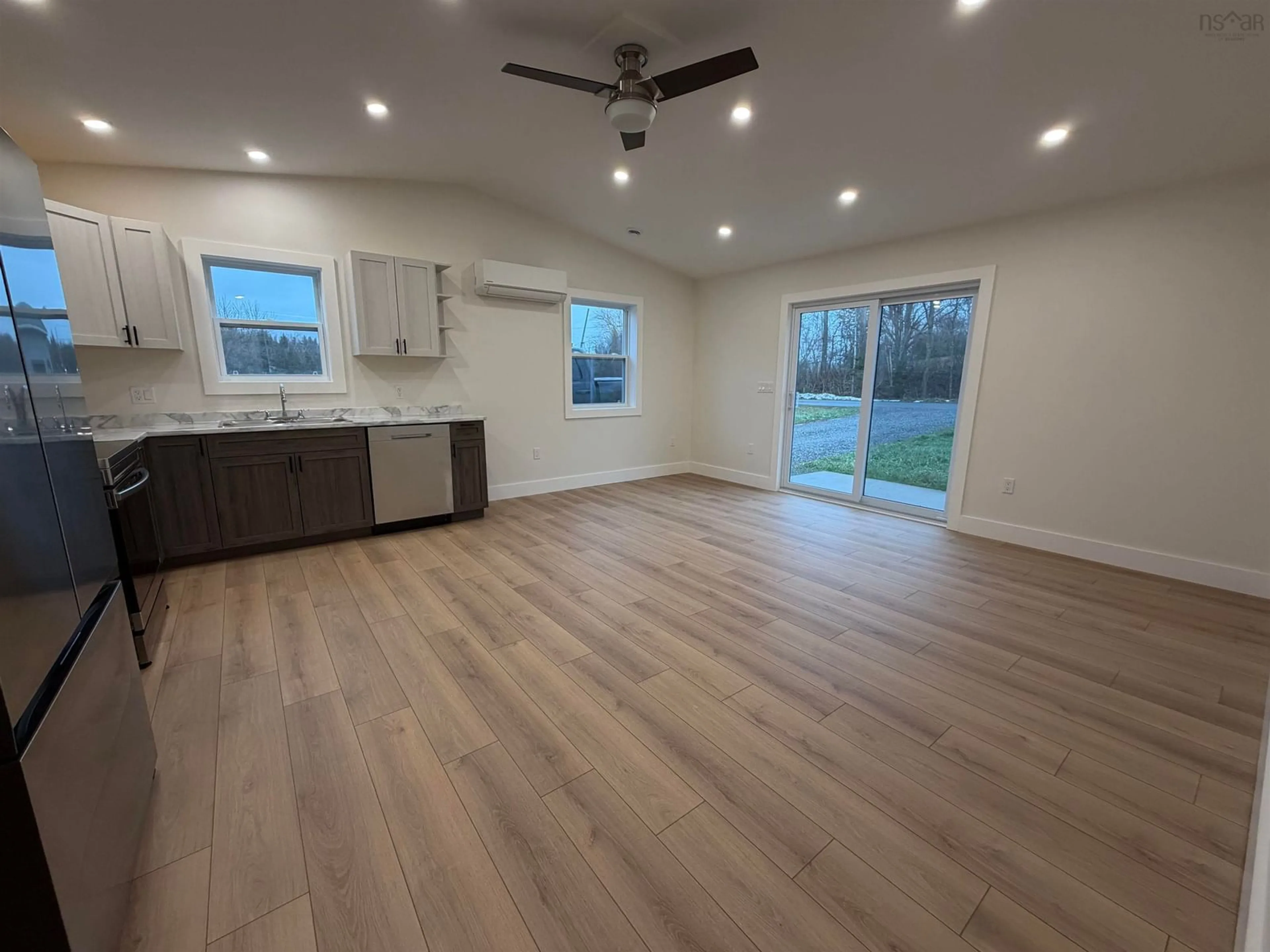 Open concept kitchen, wood/laminate floor for 821 Old Alma Rd, Alma Nova Scotia B0K 2A0