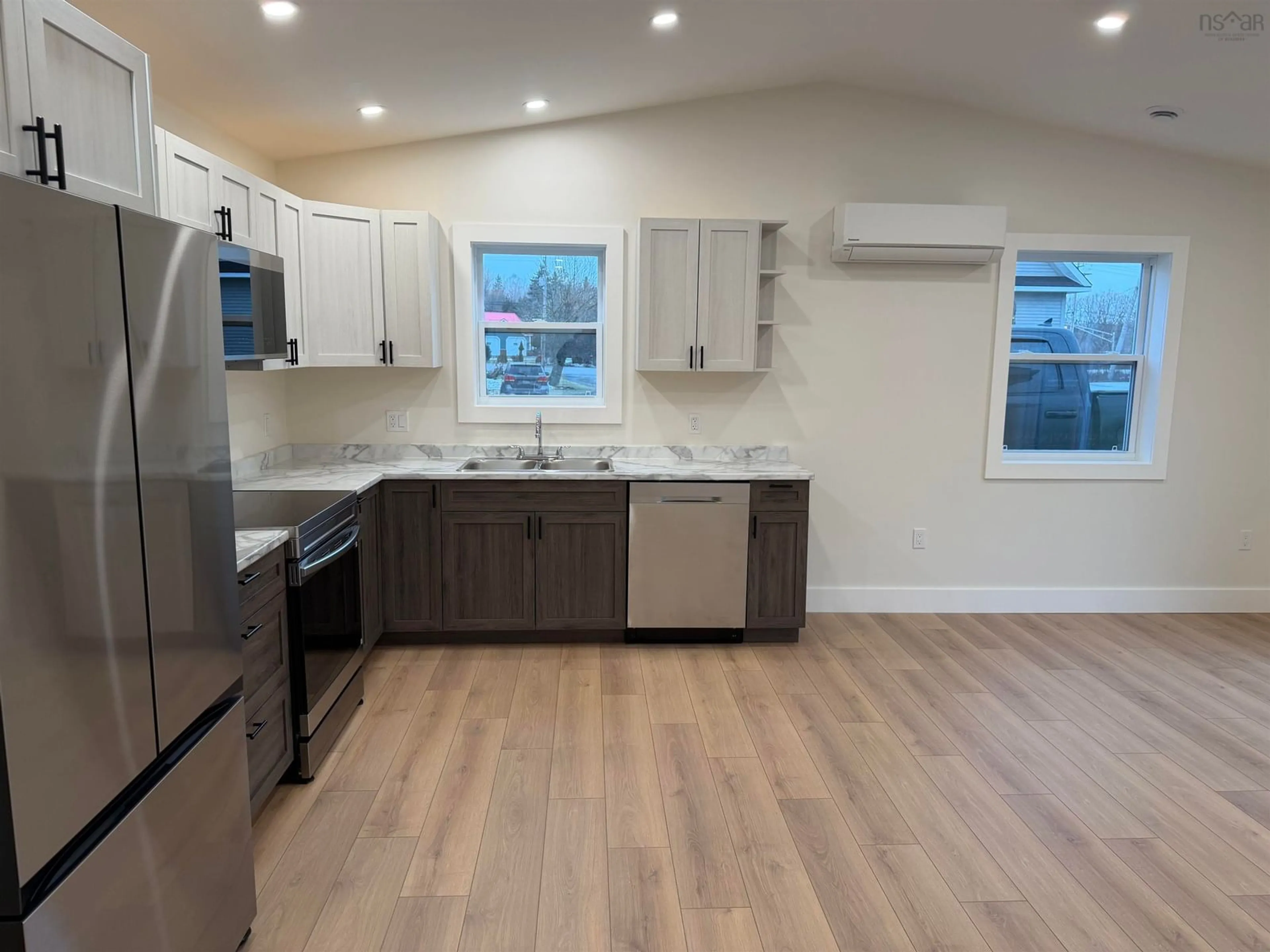 Open concept kitchen, wood/laminate floor for 821 Old Alma Rd, Alma Nova Scotia B0K 2A0