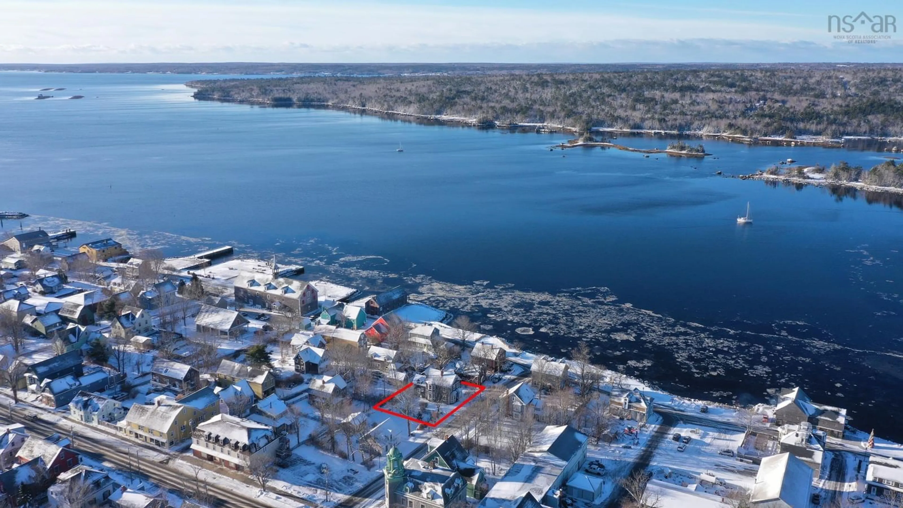 A pic from outside/outdoor area/front of a property/back of a property/a pic from drone, water/lake/river/ocean view for 13 John St, Shelburne Nova Scotia B0T 1W0