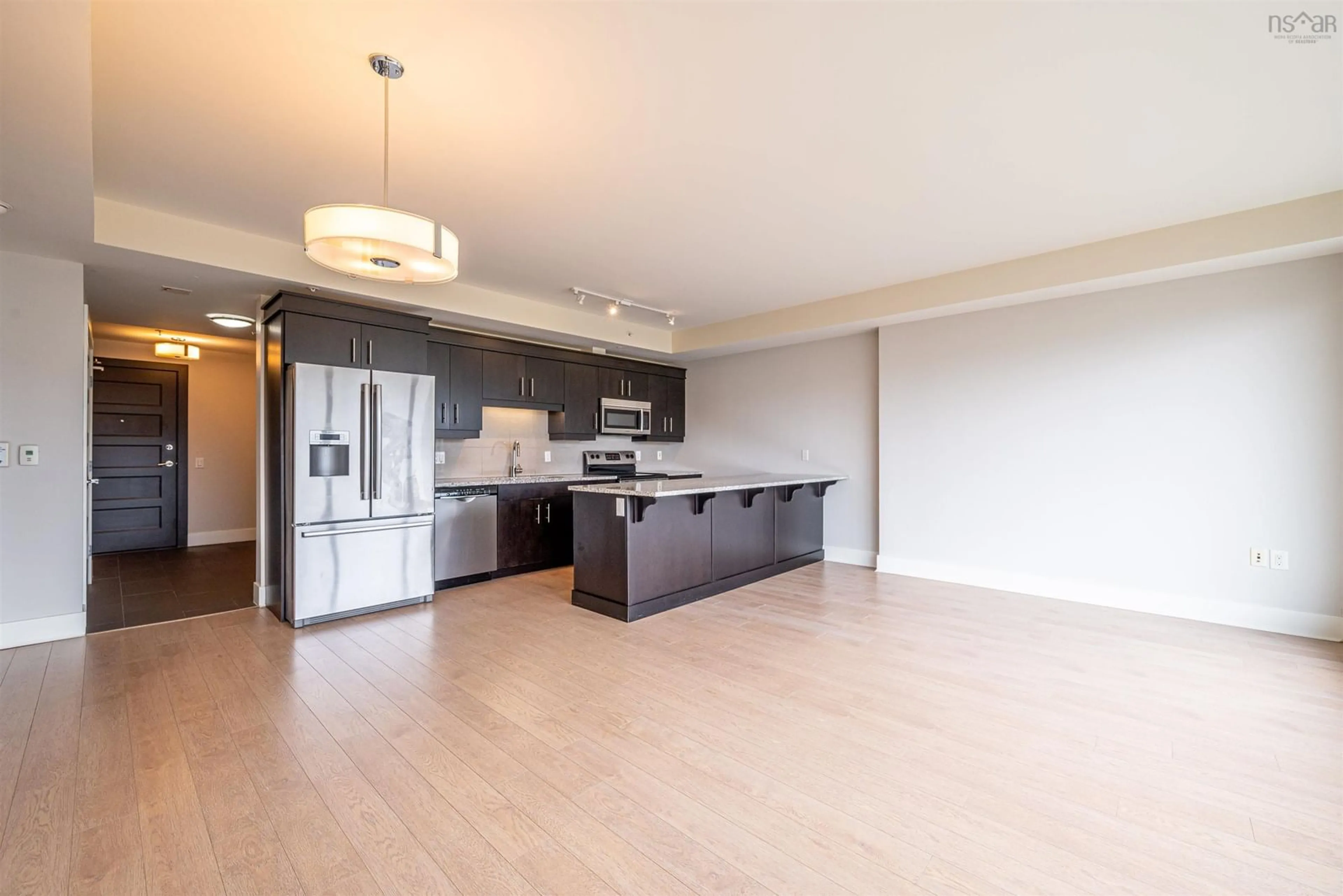 Open concept kitchen, wood/laminate floor for 15 Kings Wharf Pl #208, Dartmouth Nova Scotia B2Y 0C2