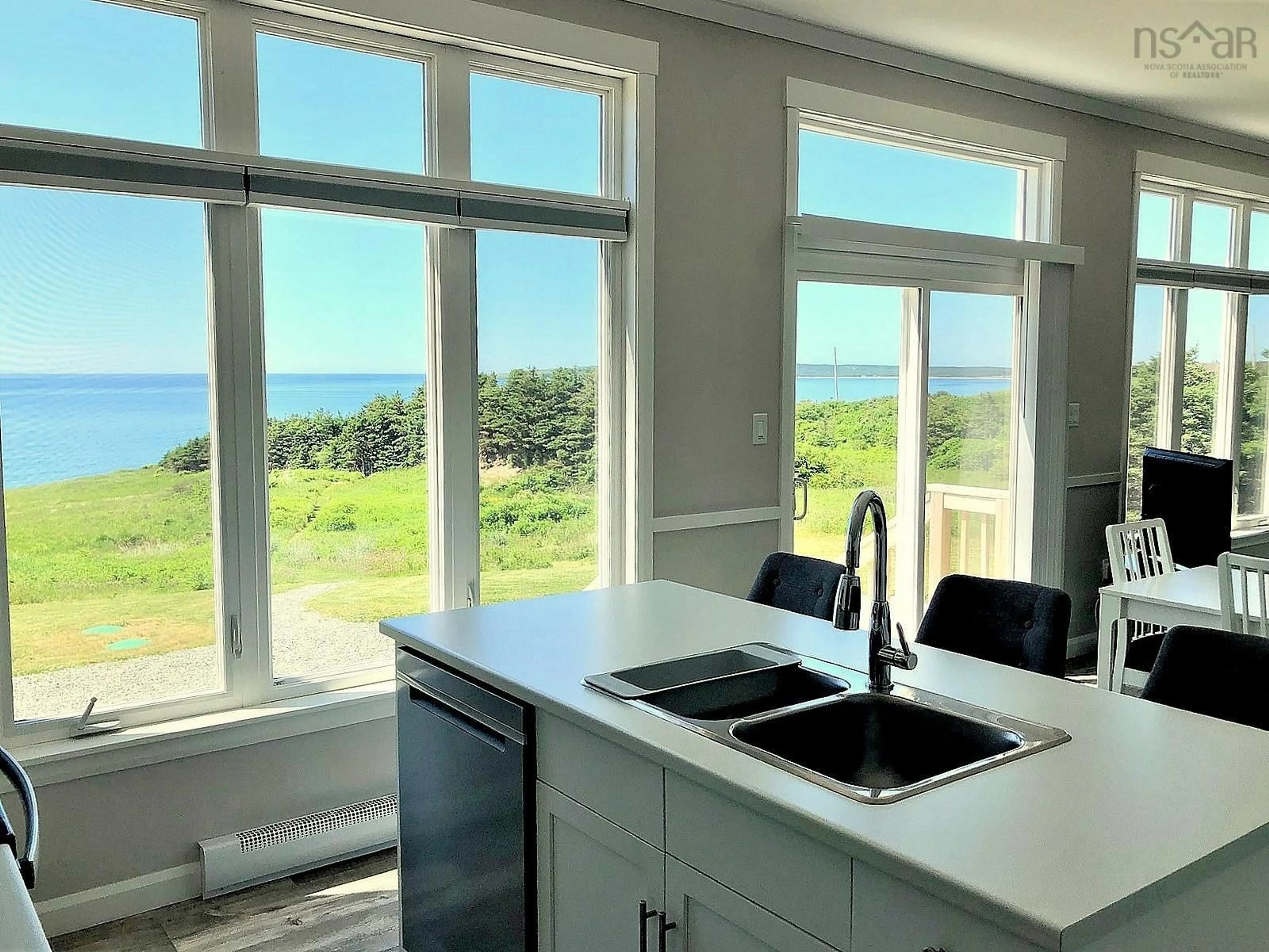 Open concept kitchen, ceramic/tile floor for 13791 Cabot Trail, Point Cross Nova Scotia B0E 1H0