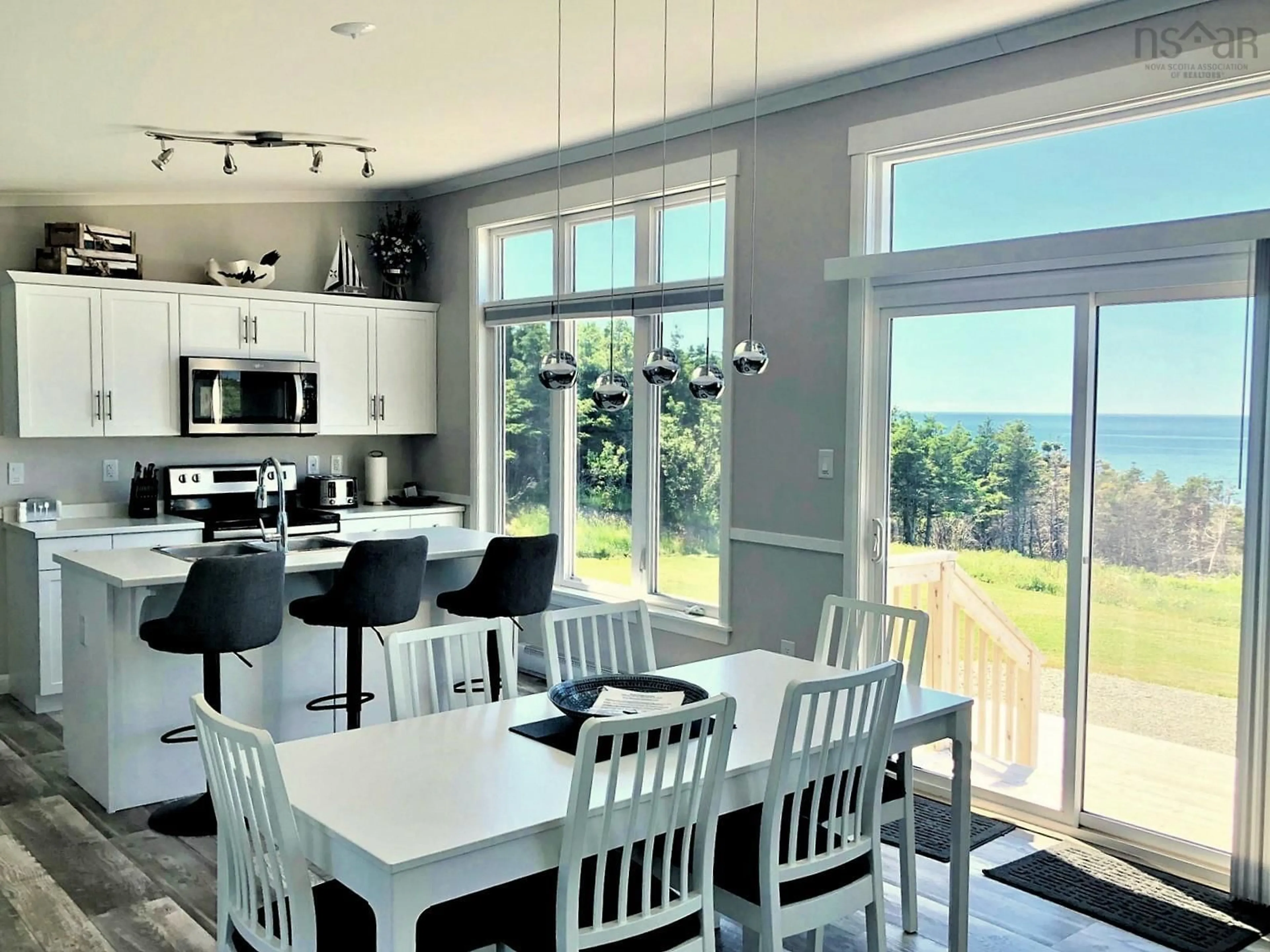 Open concept kitchen, ceramic/tile floor for 13791 Cabot Trail, Point Cross Nova Scotia B0E 1H0