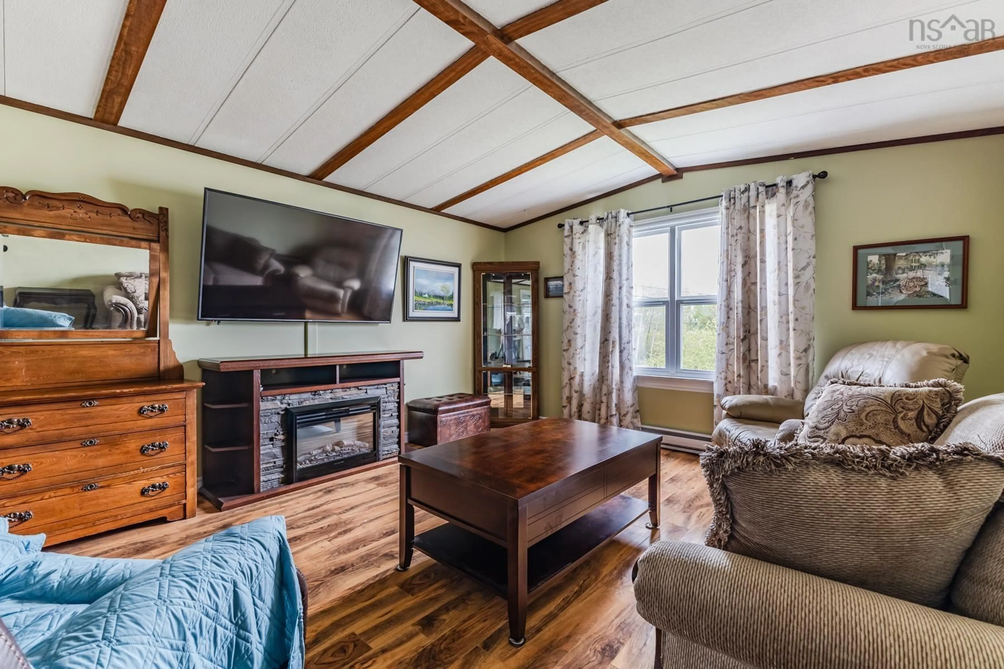 Living room with furniture, wood/laminate floor for 3 Maple St, Central Onslow Nova Scotia B6L 5H2