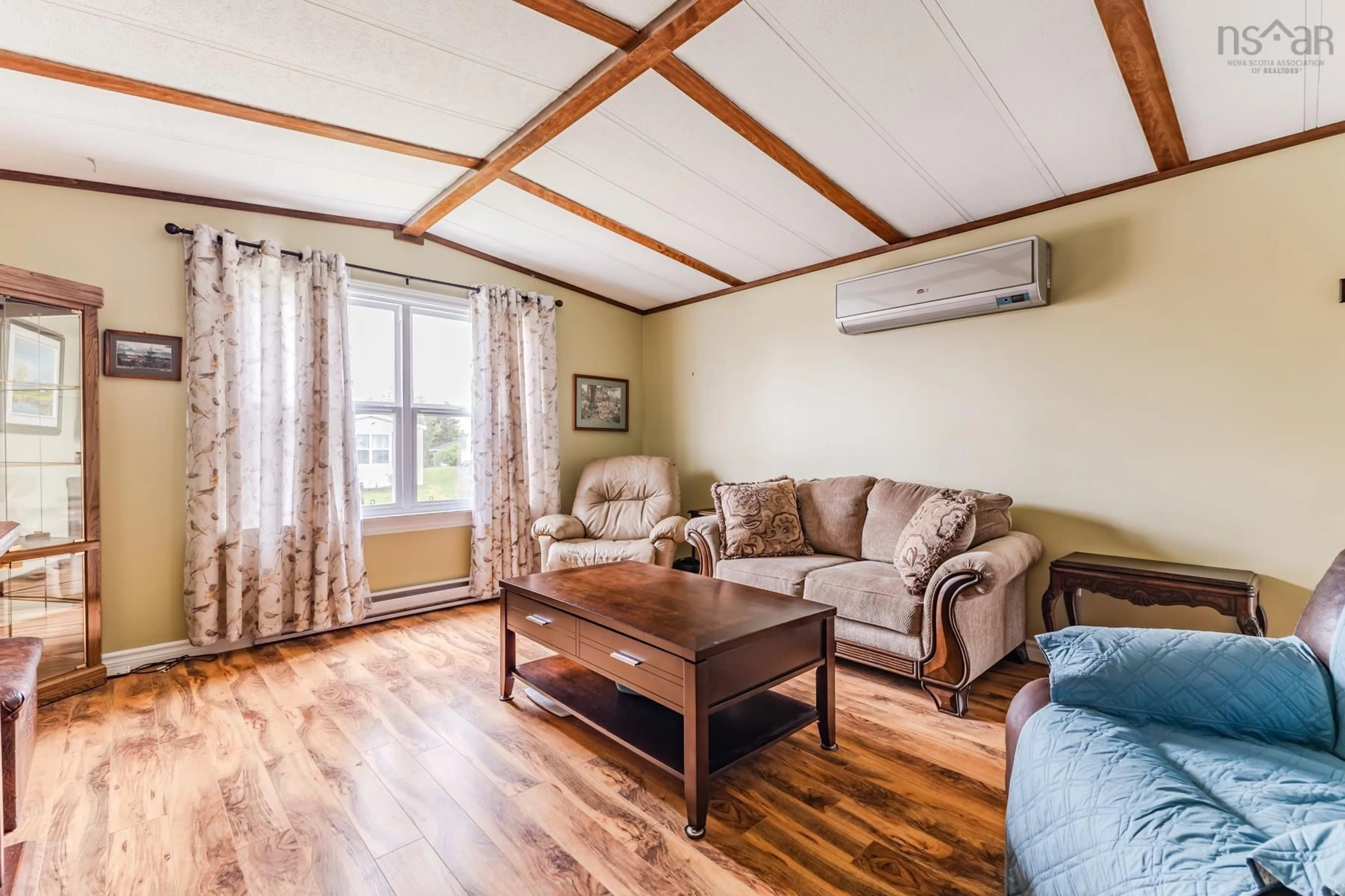 Living room with furniture, wood/laminate floor for 3 Maple St, Central Onslow Nova Scotia B6L 5H2