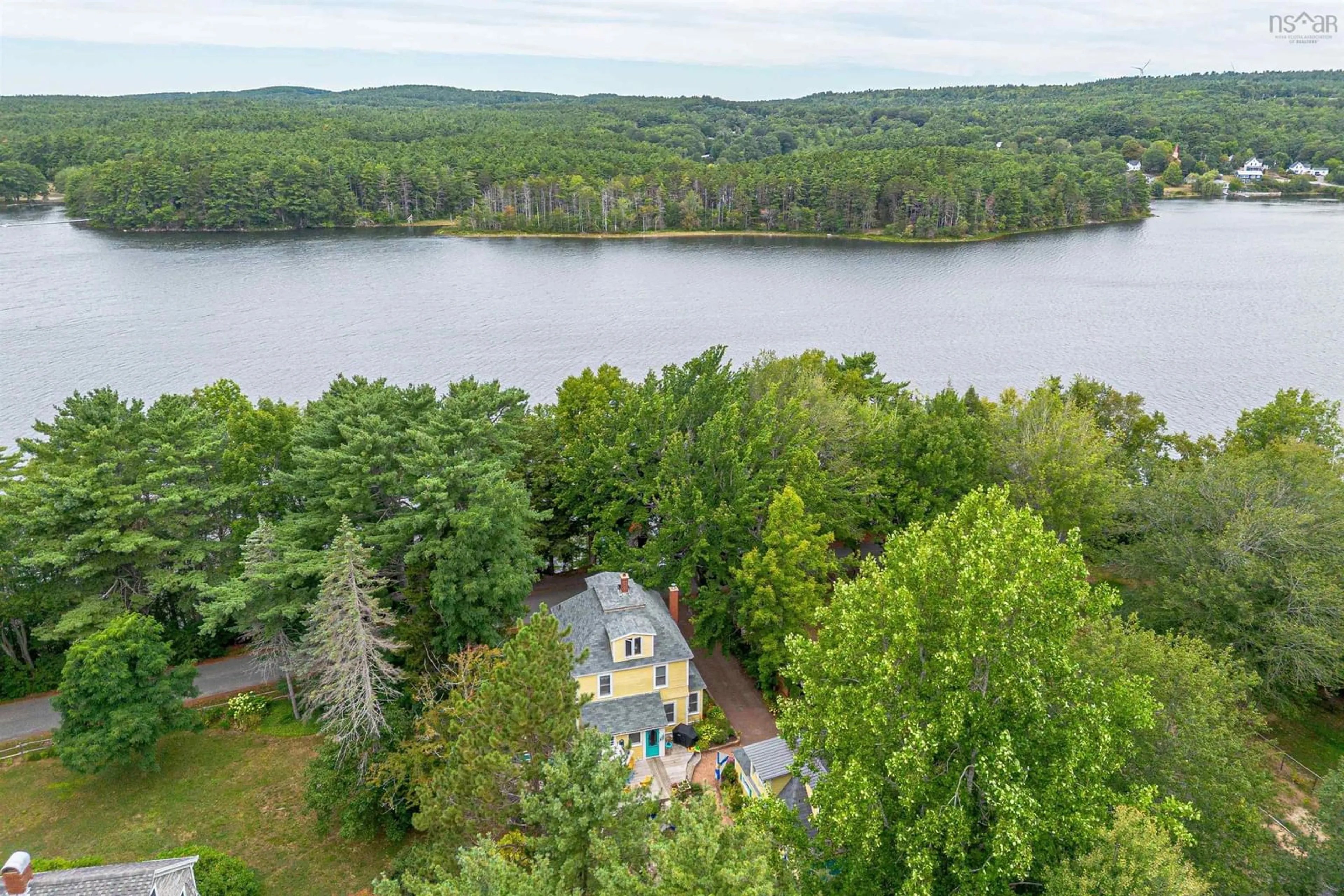 A pic from outside/outdoor area/front of a property/back of a property/a pic from drone, water/lake/river/ocean view for 78 Shore Dr, Conquerall Bank Nova Scotia B4V 0J1